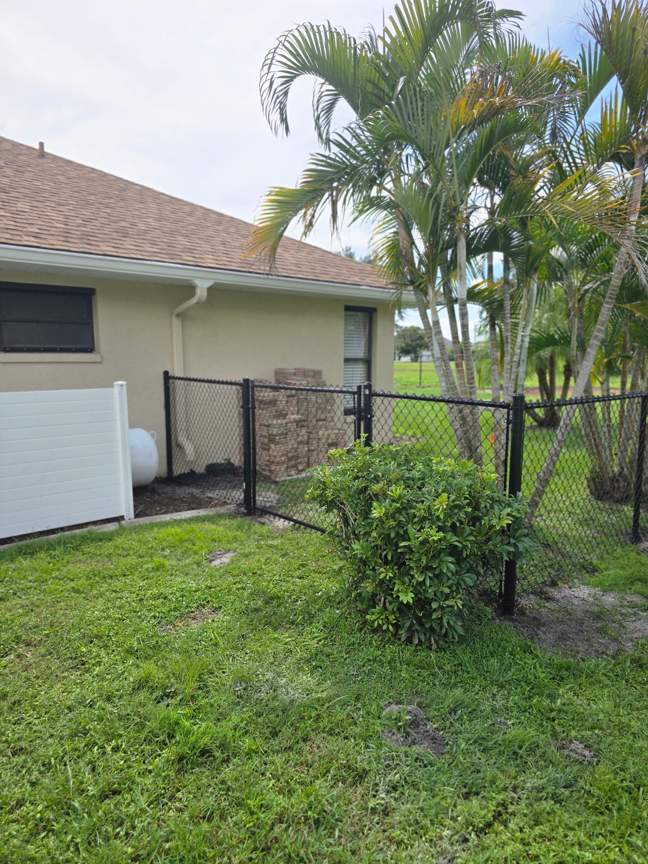Black Vinyl-Coated Chain Link Fence Installation in Punta Gorda by True Fence LLC