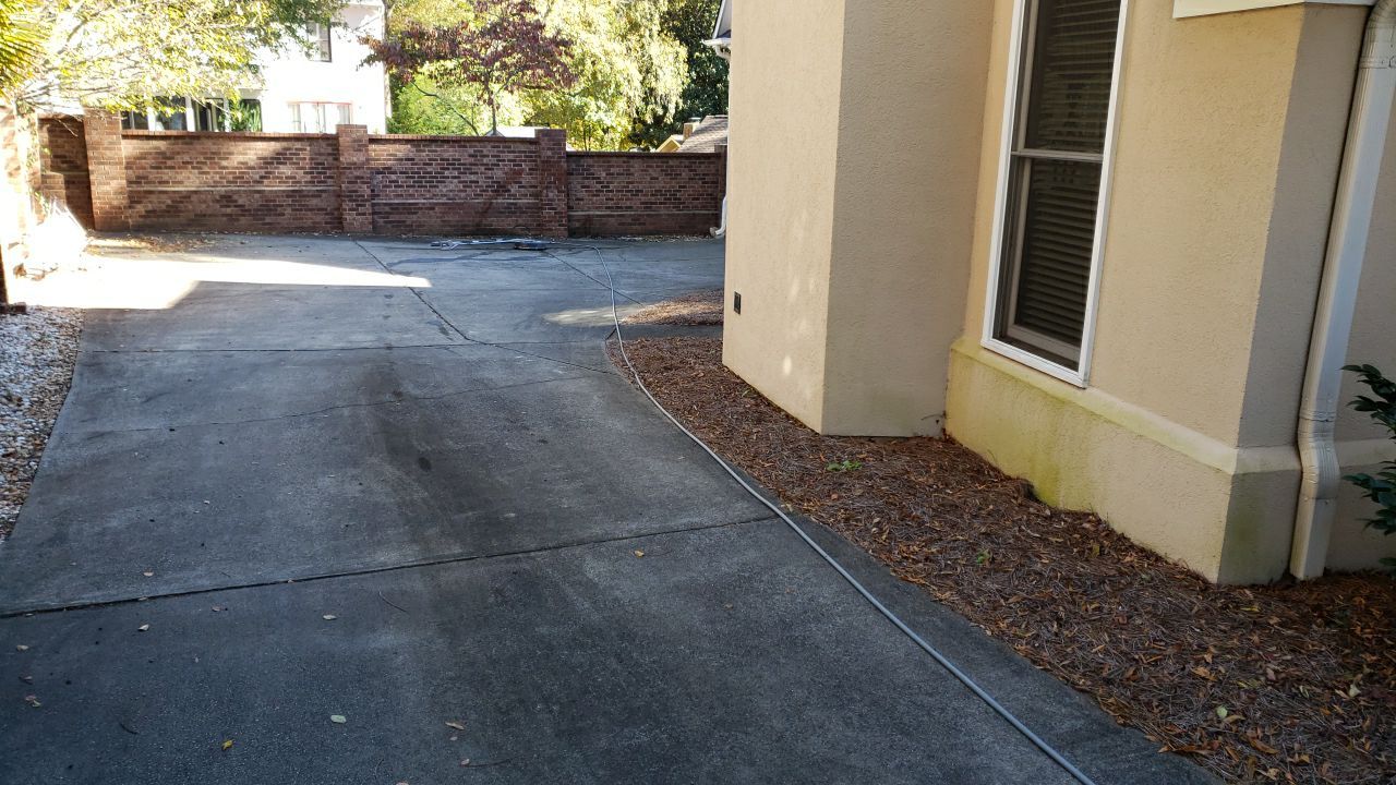 Driveway Clean using cleaner by Power Wash Masters LLC