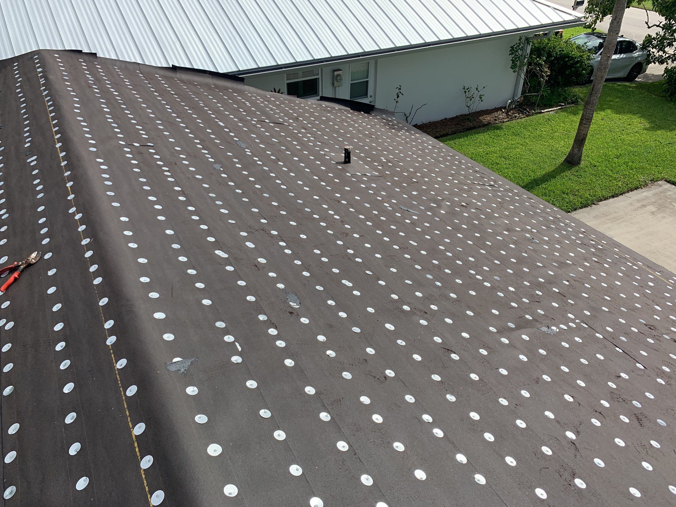 Residential Roofing Installation using 1" Nail strip metal roof by BLUES BROTHERS ROOFING