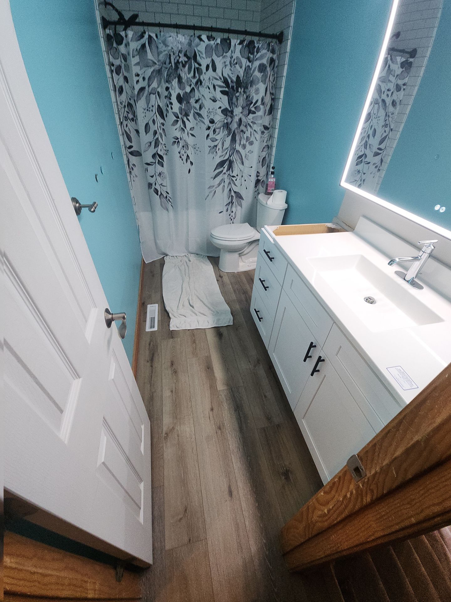 Bathroom Remodel using Luxury Vinyl Plank by The Shower Company