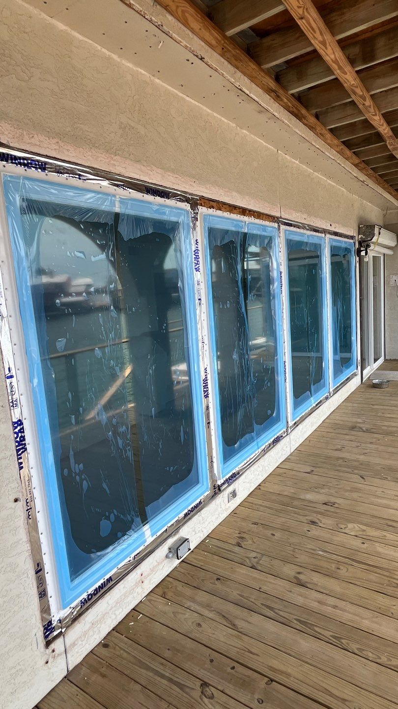 Installing Windows on a Submarine  by Bayfront Roofing and Construction