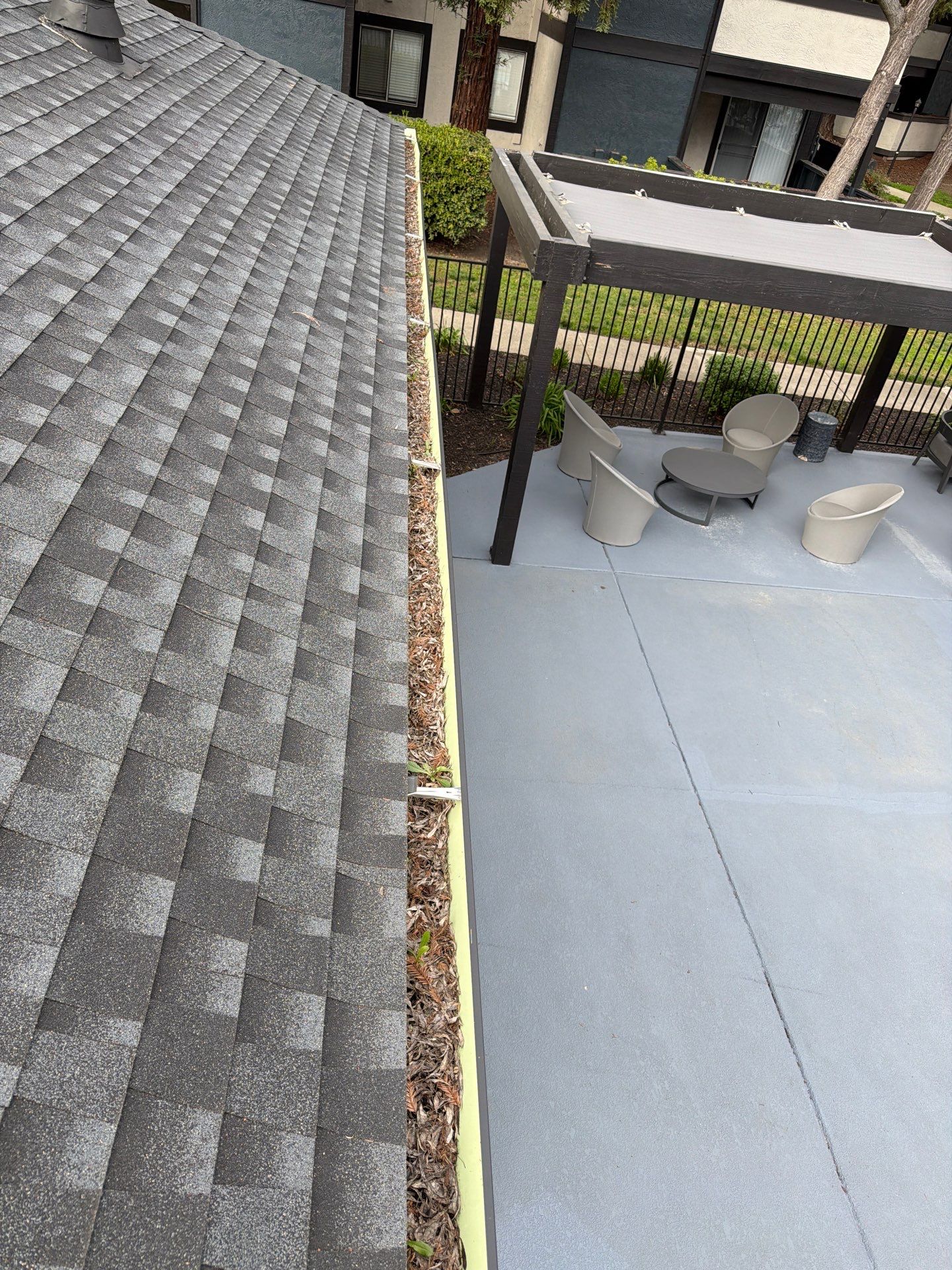 HOA gutter cleaning in Napa, CA,before  photo showing full gutters.