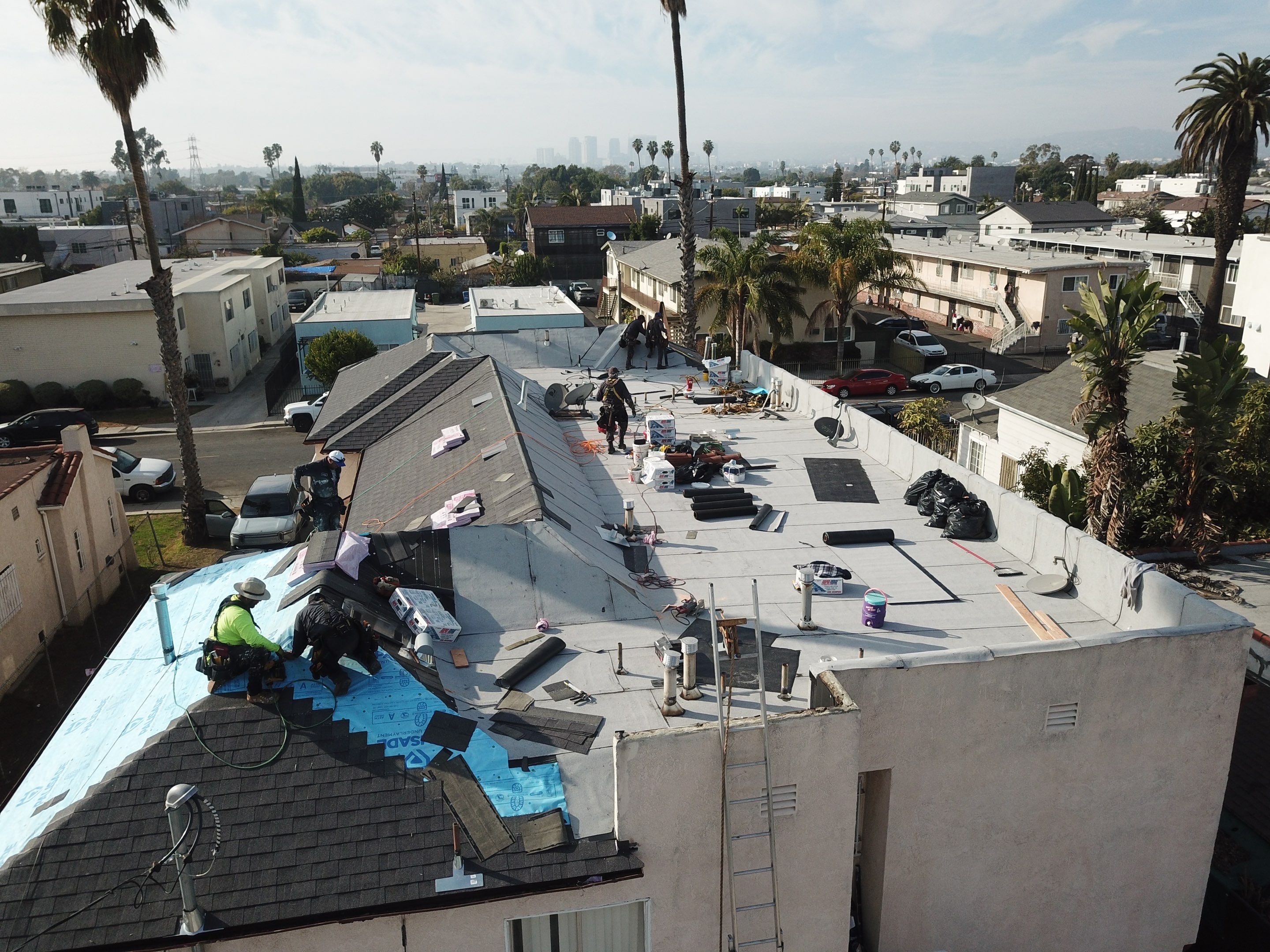 Apartment Building Roofing Installation using CertainTeed GTA Modified Bitument System by Hull Brothers Roofing