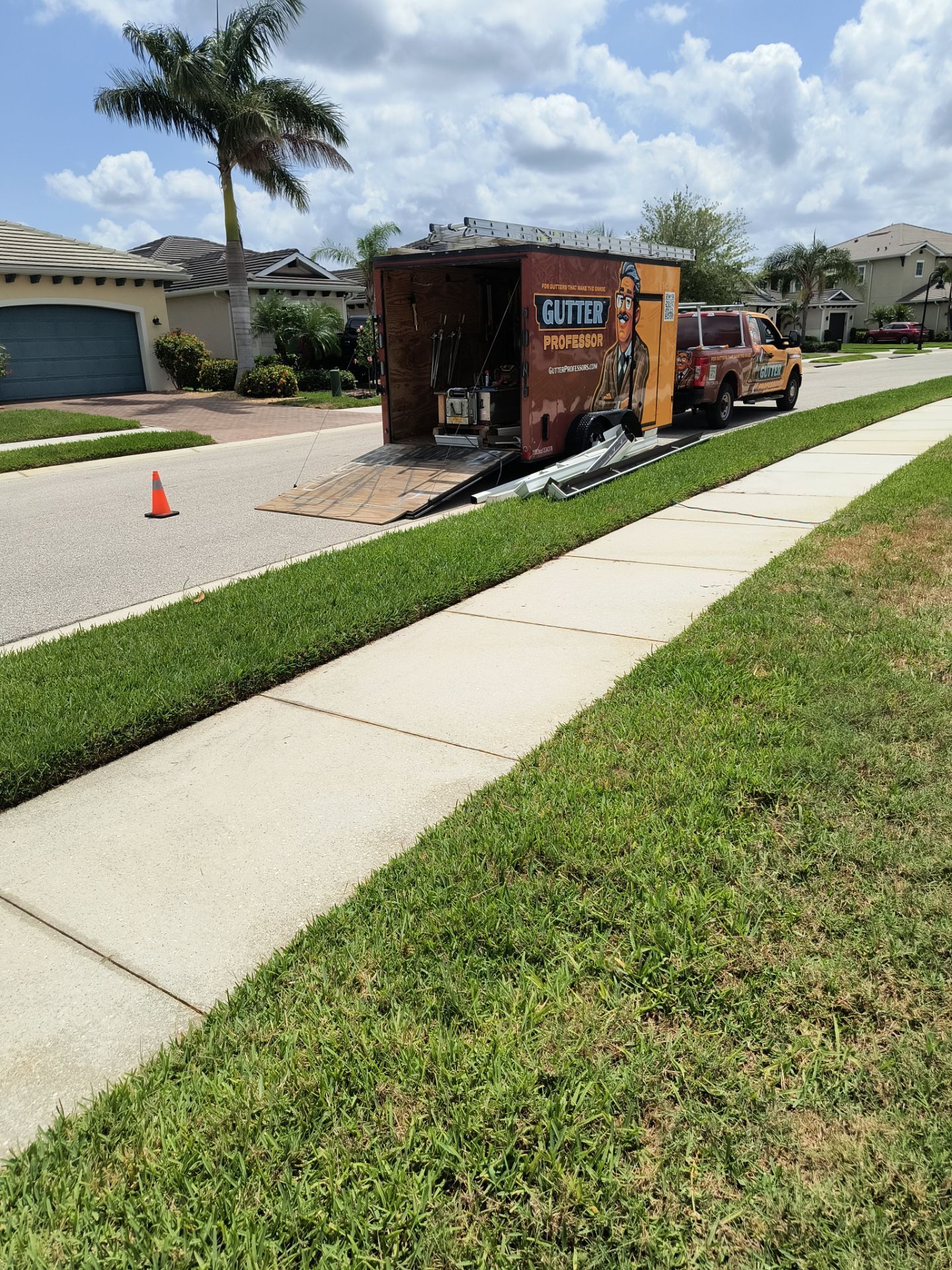 White Seamless Gutters with Downspouts in Bradenton FL by Gutter Professors