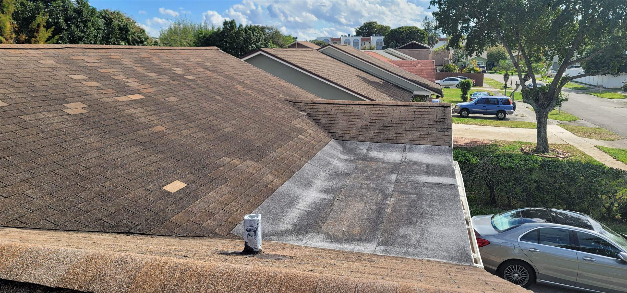 Standing Seam Metal & Flat Re-Roof using 1.5" Nail Strip 24ga Solar White Kynar Coated Standing Seam Metal Panels by Morton Roofing, Inc.