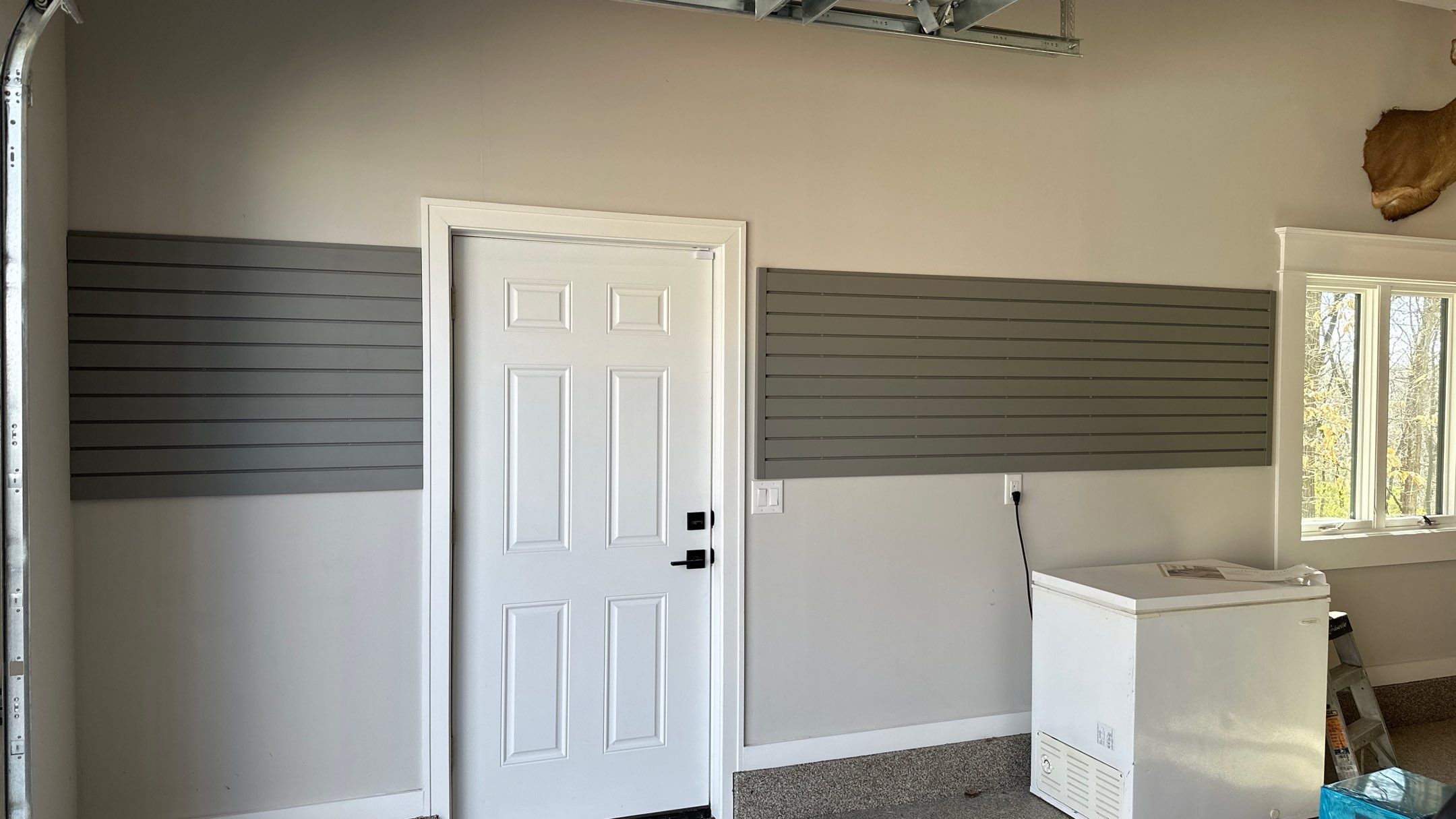Robert B. upgraded his garage with cabinets and slotwall   by Banner Garage
