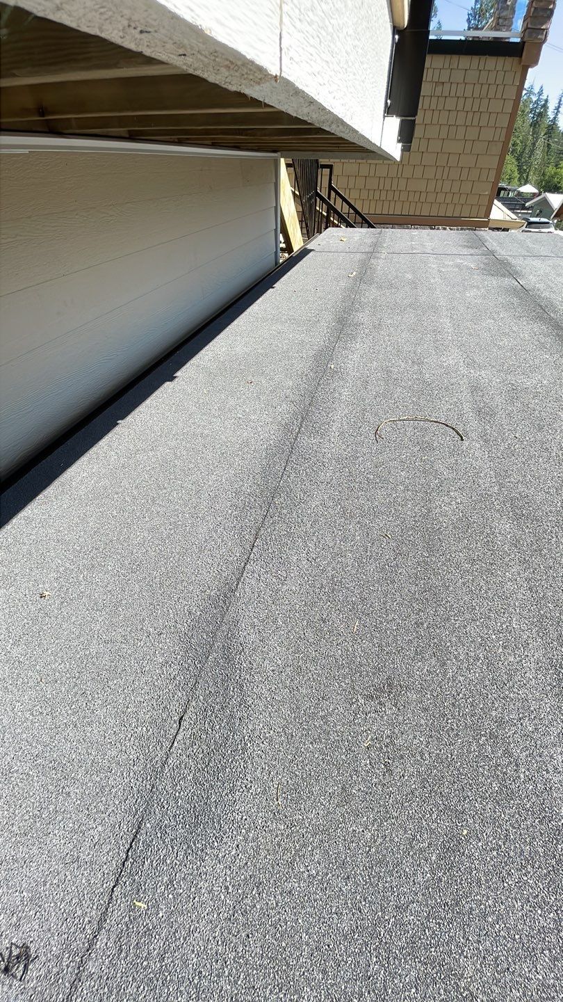 Small patio roof with 2ply sbs  by Top Notch Roofing Inc