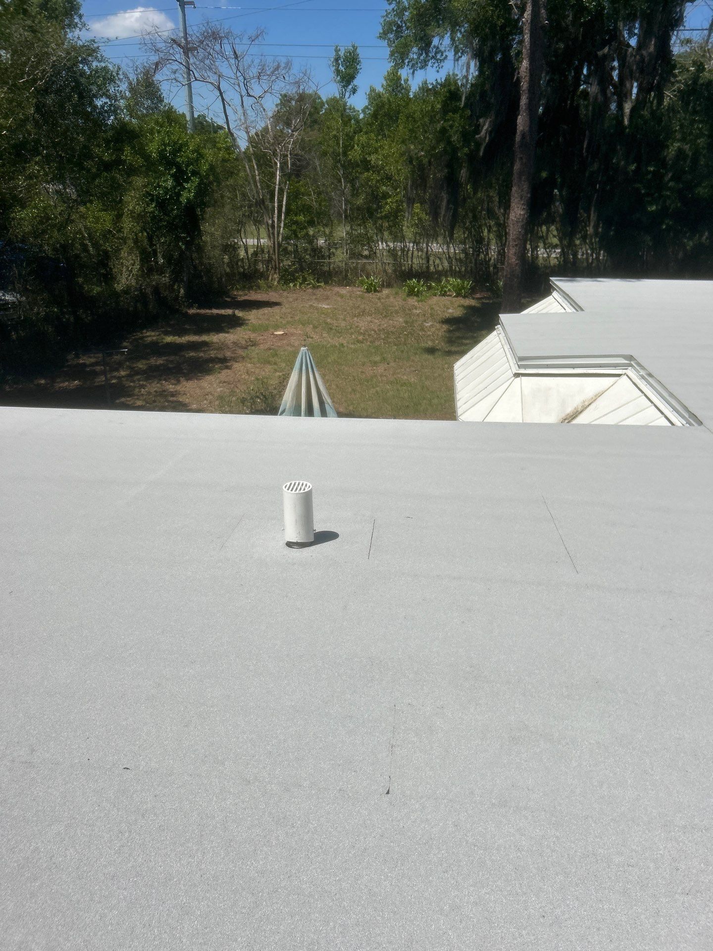 Flat Roof Replacement and Wood Decking Repair in Maitland by Tip Top Roofing Co., Inc.