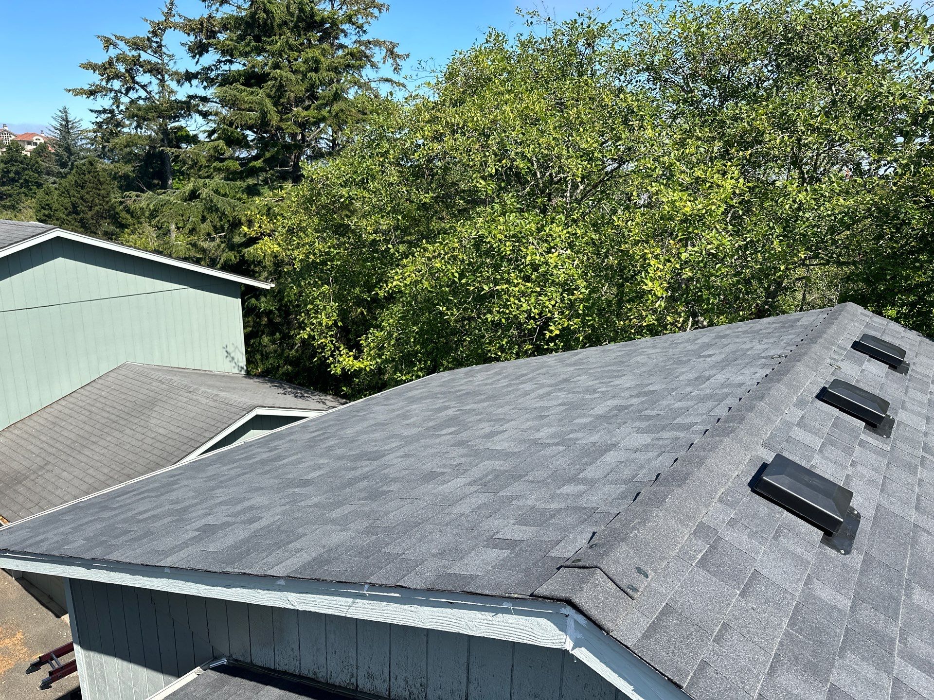 Residential Roofing Installation using Malarkey Highlander (Color: Midnight Black) by Orezona Building & Roofing Company, Inc.
