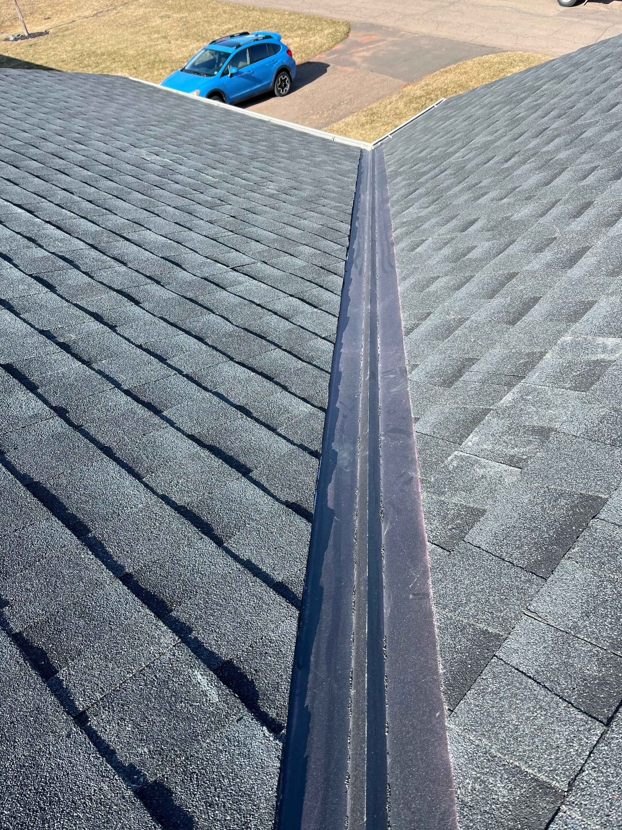 Residential Roofing Installation using Asphalt GAF HDZ in Charcoal by Artisan Roofing & Home Improvements Inc.