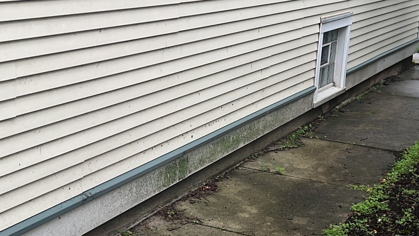 Housewashing  using Algaecide, soft wash soap by Northern Power Washing LLC.