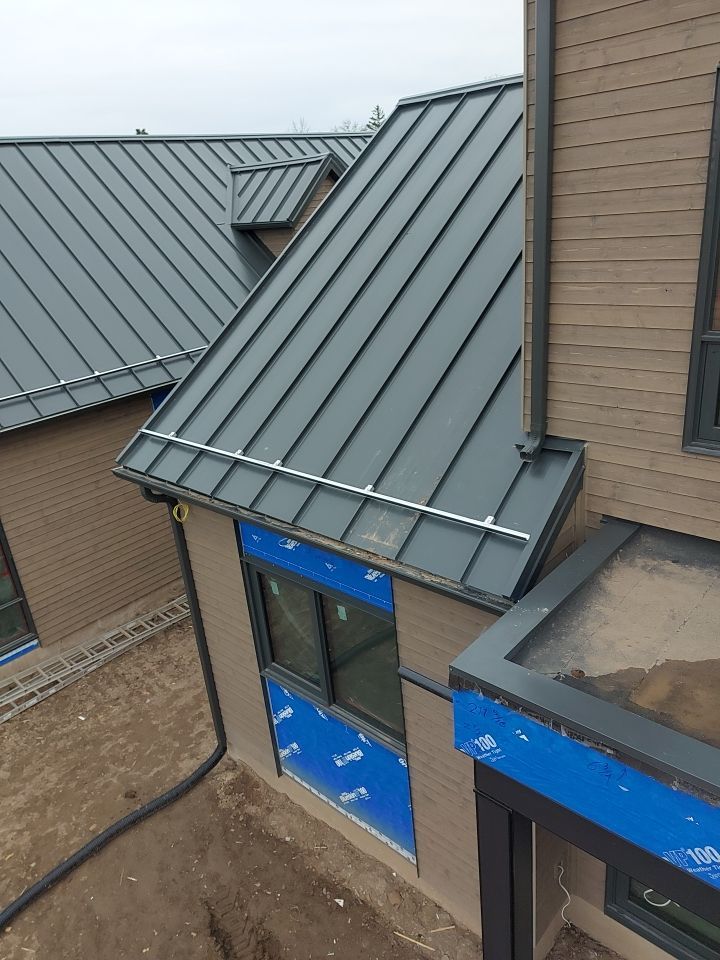 New Home Construction using 16" Standing Seam Panels by Jay Carter Roofing & Sheet Metal