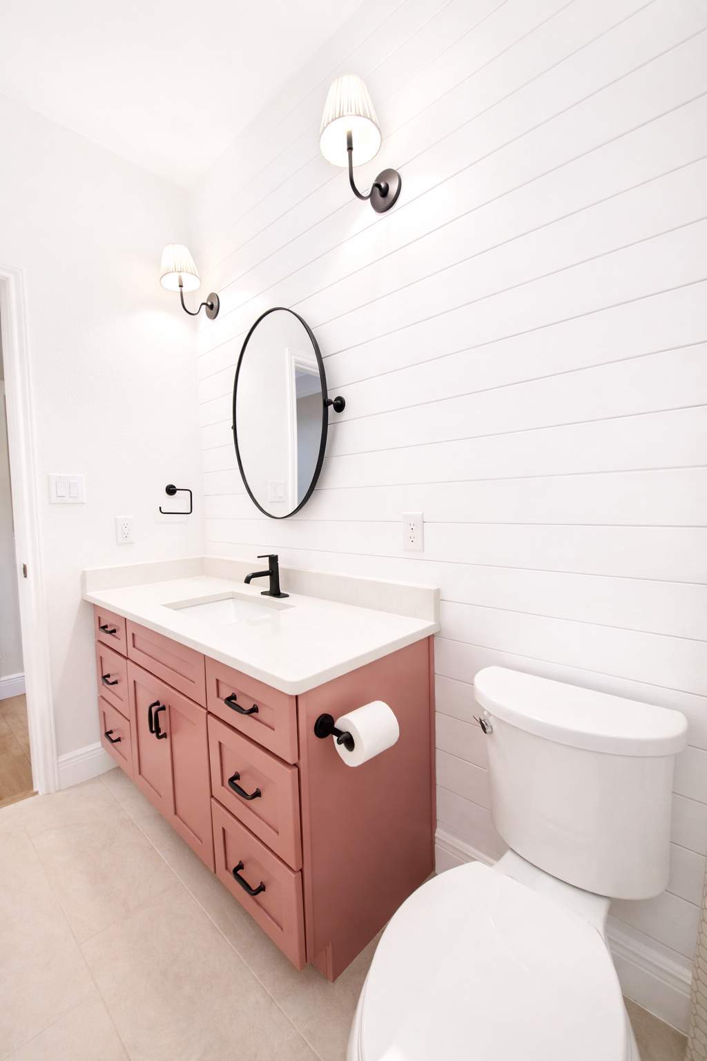 Stone Oak Hall Bathroom Remodel with Pink Vanity and Curved Shower Glass by Legacy Bath and Kitchen