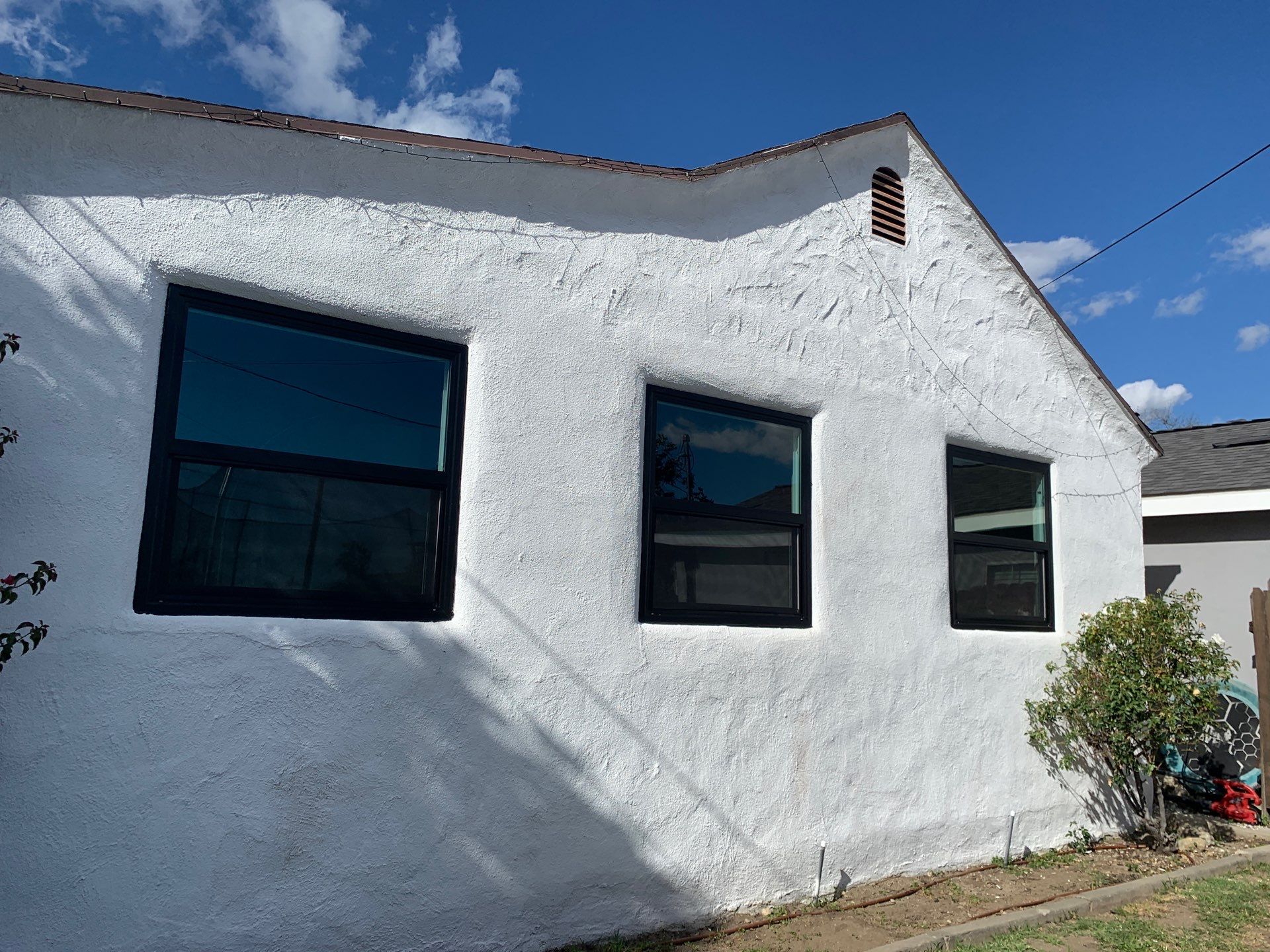 Window Installation using Black Anlin windows by American Window Company