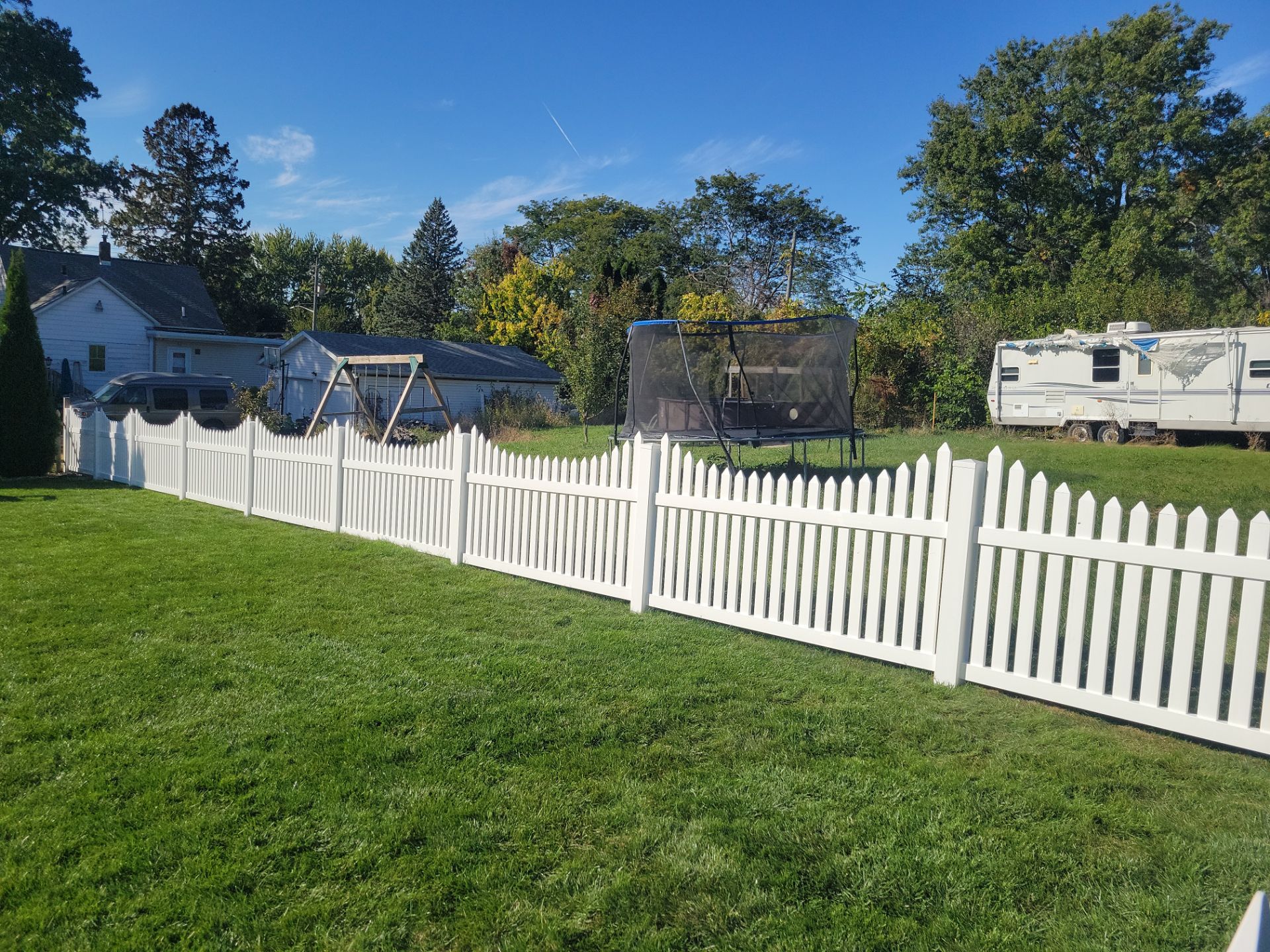 White Vinyl Spaced Picket Fence Installation in Waterloo by Perfect Picket Fence and Stain