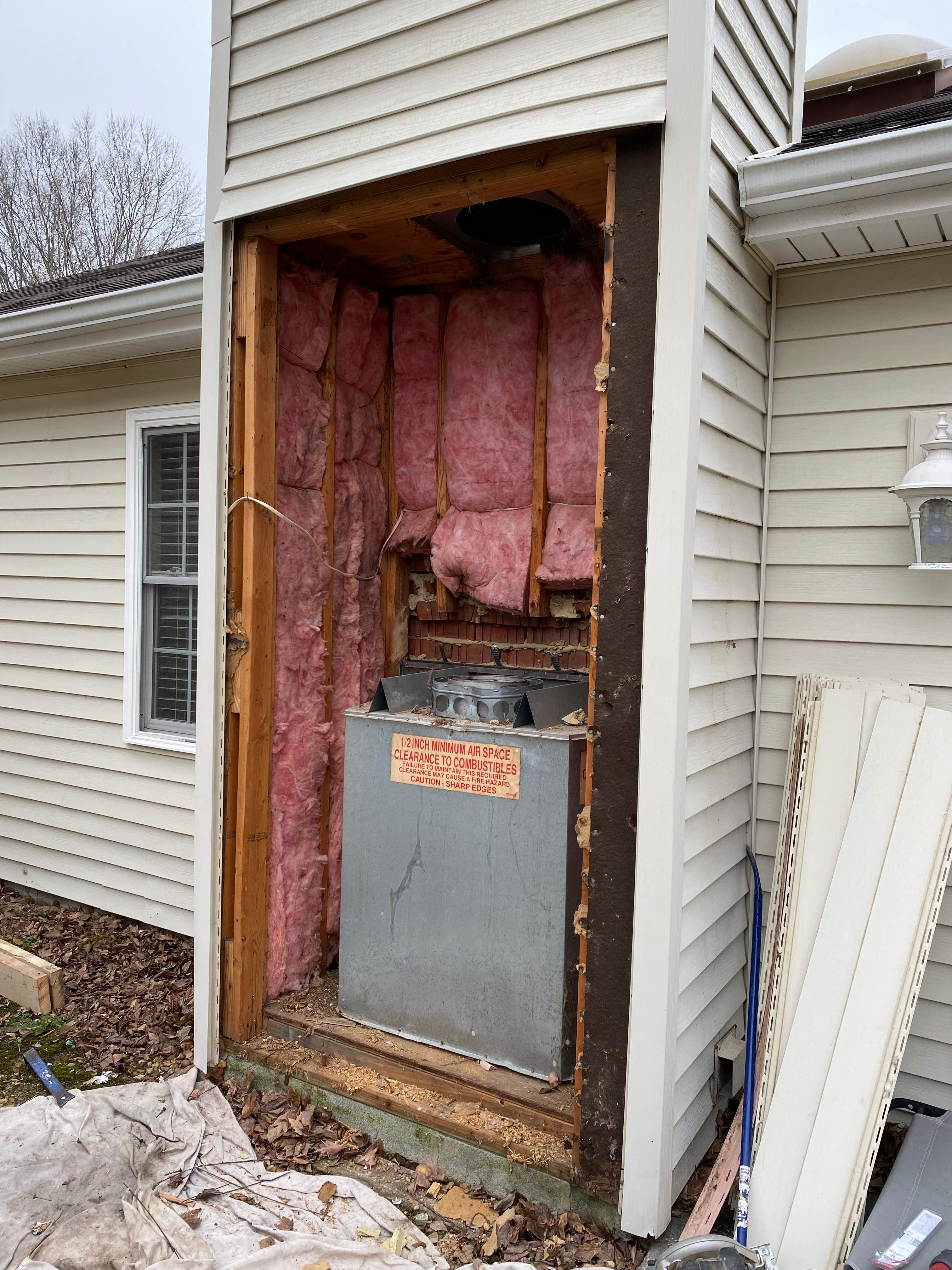 Wood Prefab Fireplace Replacement in Virginia Beach by Premier Chimney and Roofing