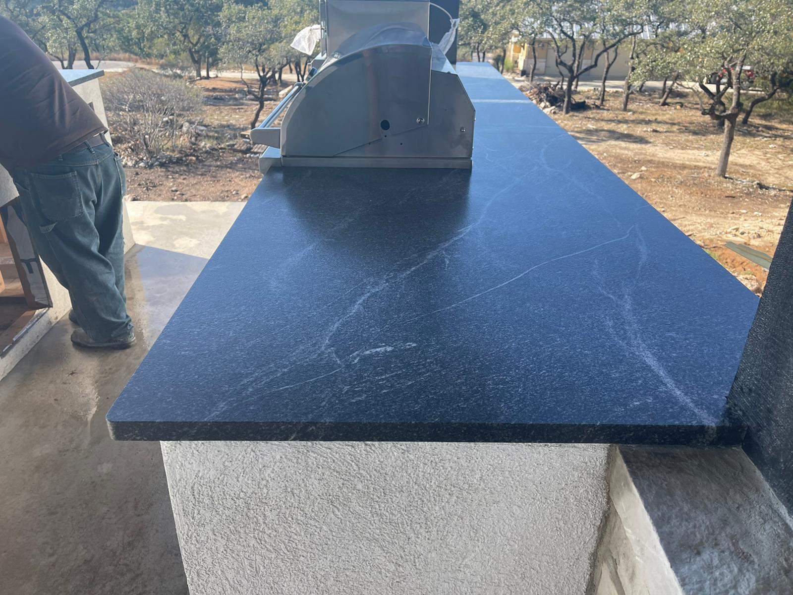 Outdoor kitchen using Black mist honed granite by Mena stone surfaces