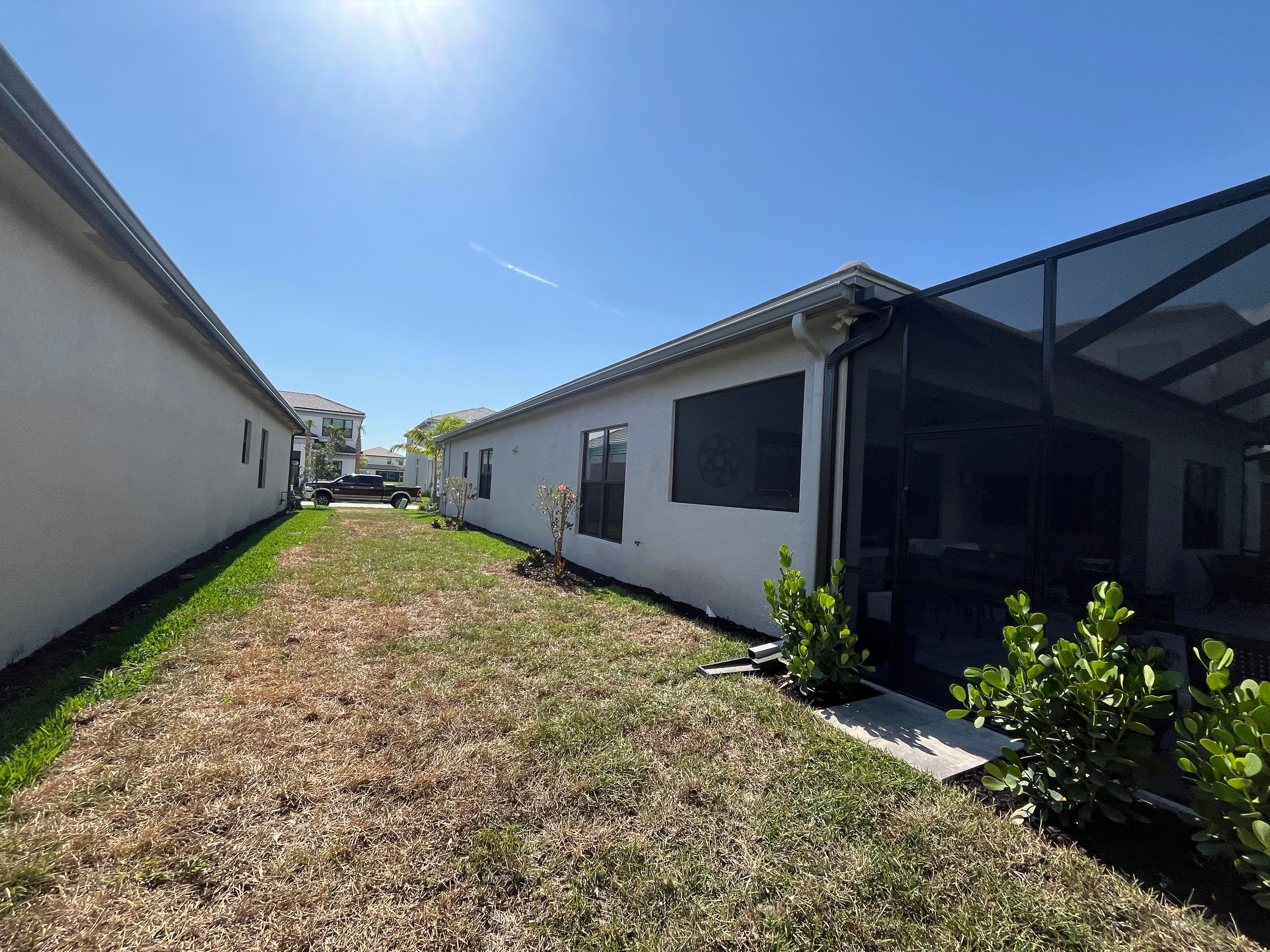 Grey Seamless Gutter Installation in Estero FL by Gutter Professors