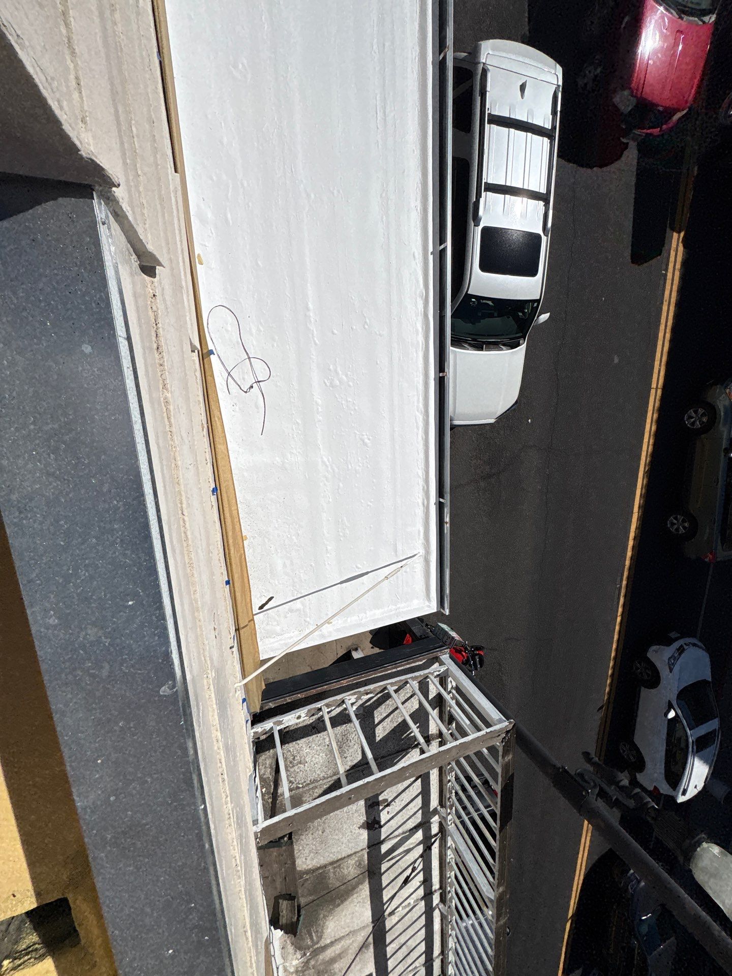 Foam and coatings on commercial roof by Straight Edge Roofing Inc