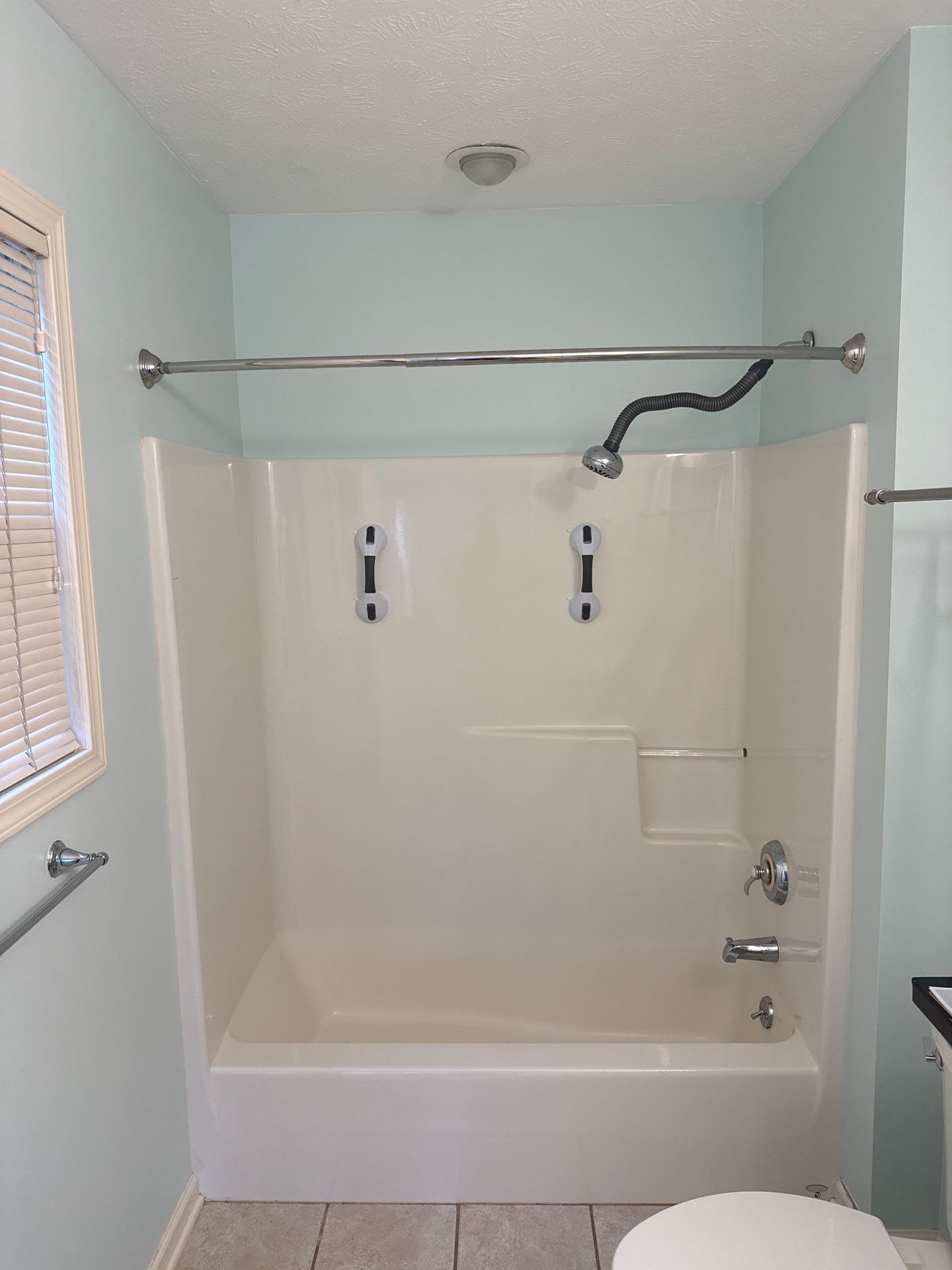 Sliding Glass Shower Door and Bathtub Surround Installation in Manistee by Rainbow Seamless Systems