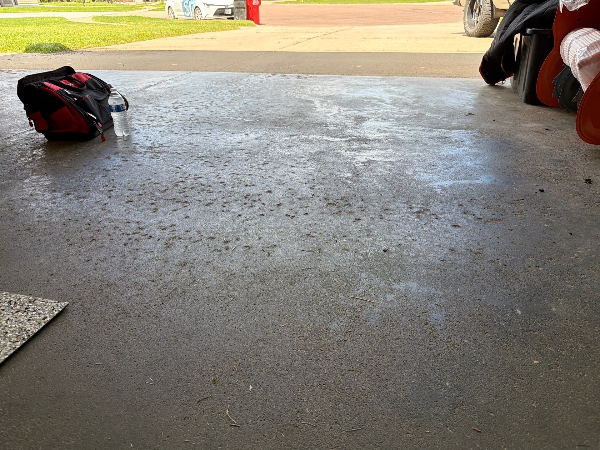 Cabin FEver Flake Garage Floor Coating Installation in Sioux Falls by Select Painting, Coatings & Garage Cabinets