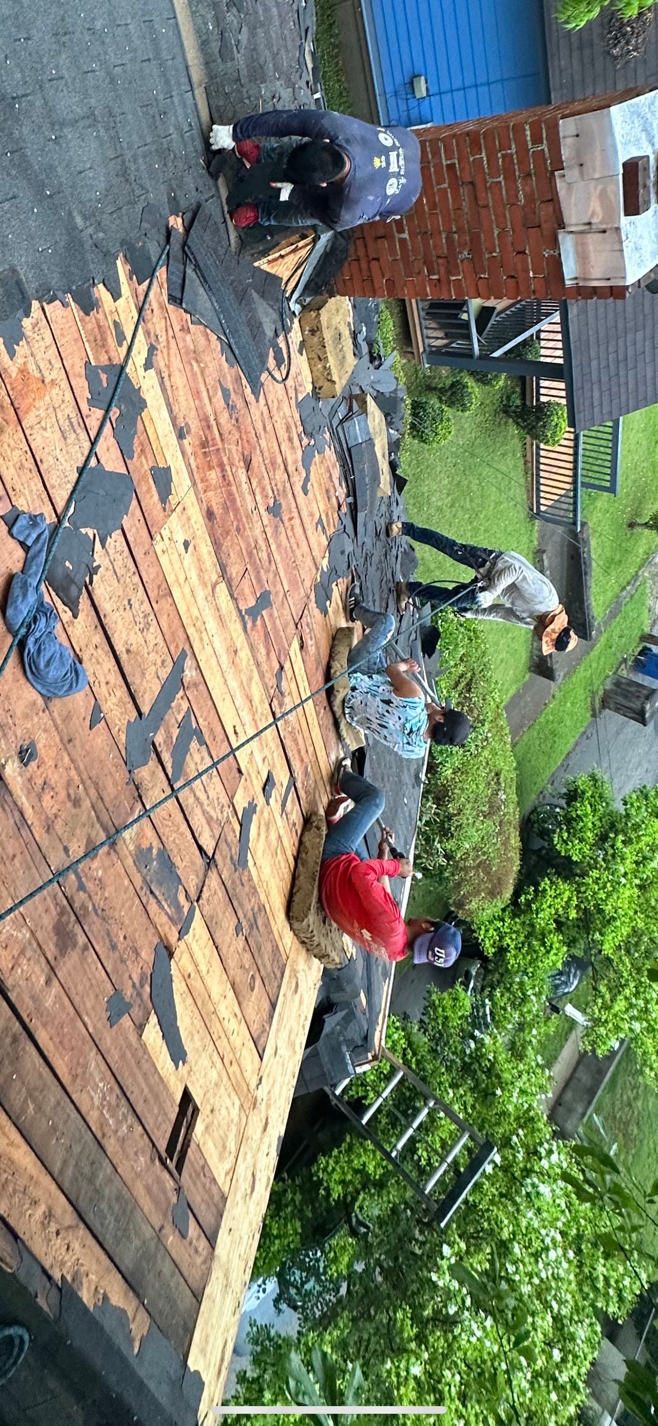 roof replacement and new black gutters by Nailed It Roofing & Remodeling LLC