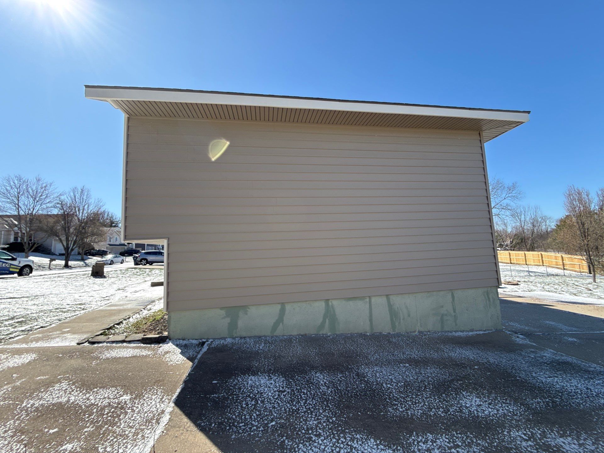 Kansas City Horizontal Vinyl Siding Installation for Split-Level Residence by EEC Windows, Siding & Roofing