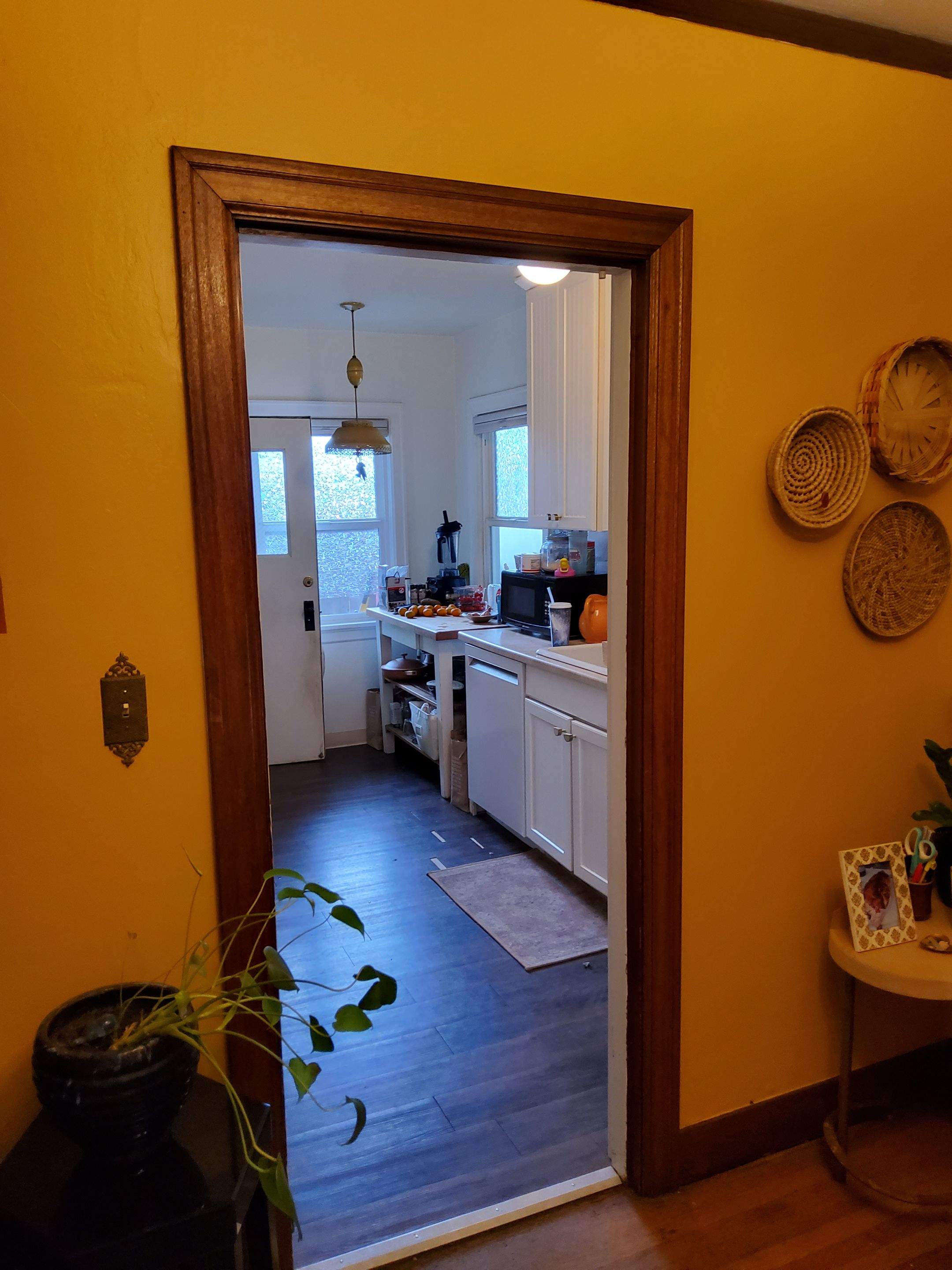 Complete Kitchen Remodeling Featuring Terracotta Tile and Wood Cabinetry by American Made Construction 