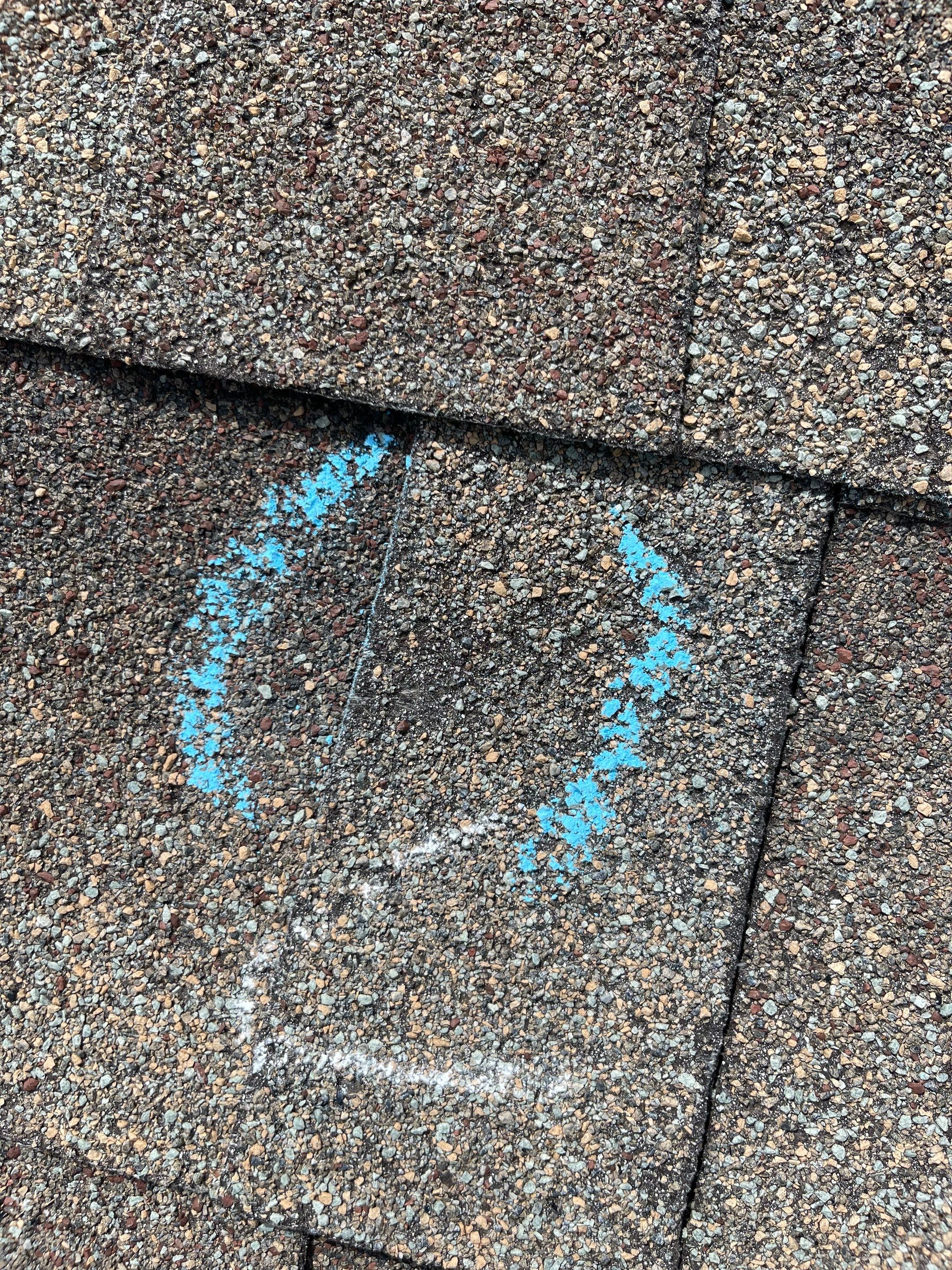 Hail Damage on a Roofing System by Icon Roofing And Construction 