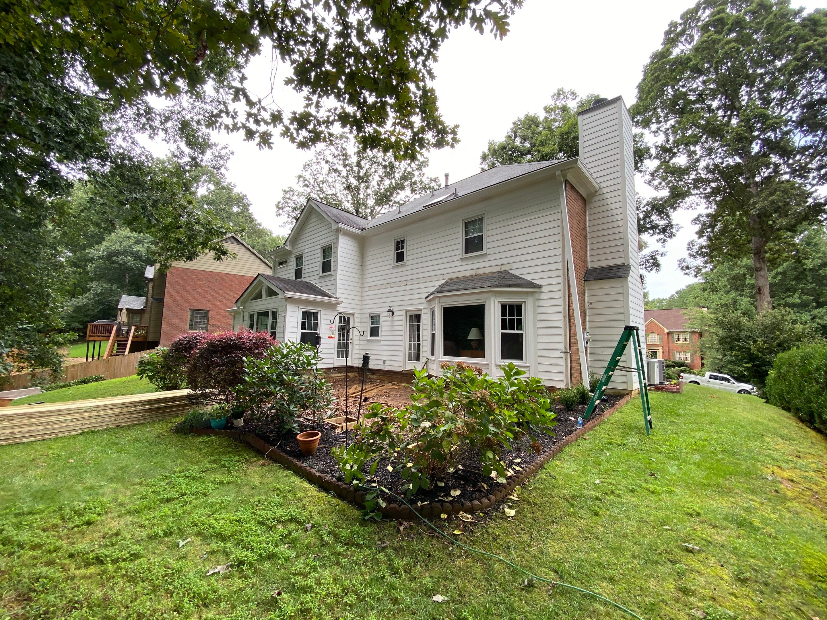 Custom Screened Porch with Beadboard Ceiling and Composite Decking by Swift Home Renovations