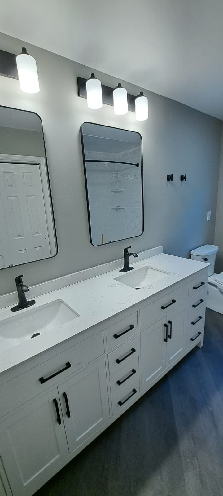 Bathroom Remodel using LVP Flooring by Home Concepts Construction