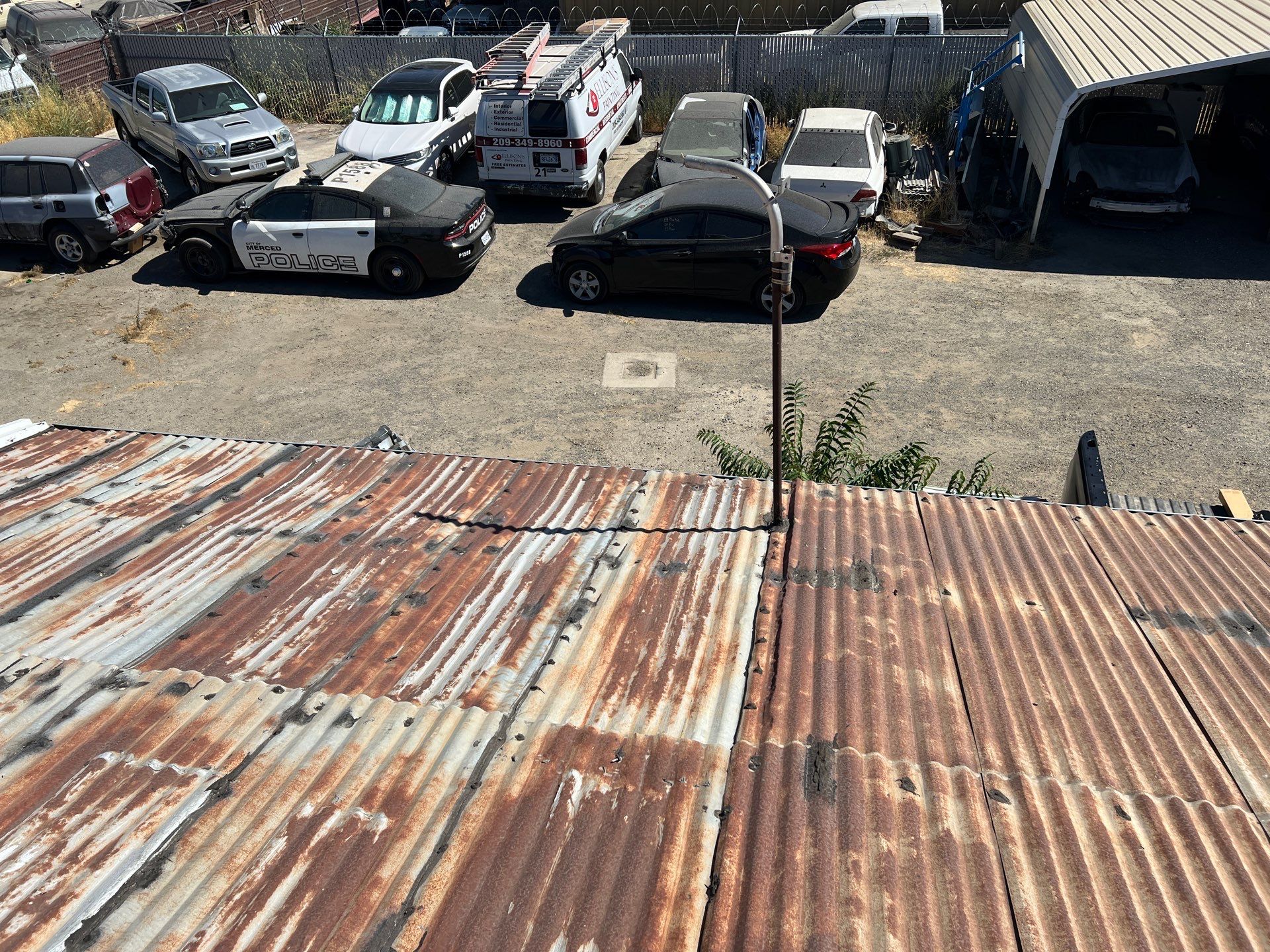 Spray foam and coatings using Conklin Benchmark/ PUMA XL acrylic coatings over metal and foam by Straight Edge Roofing Inc