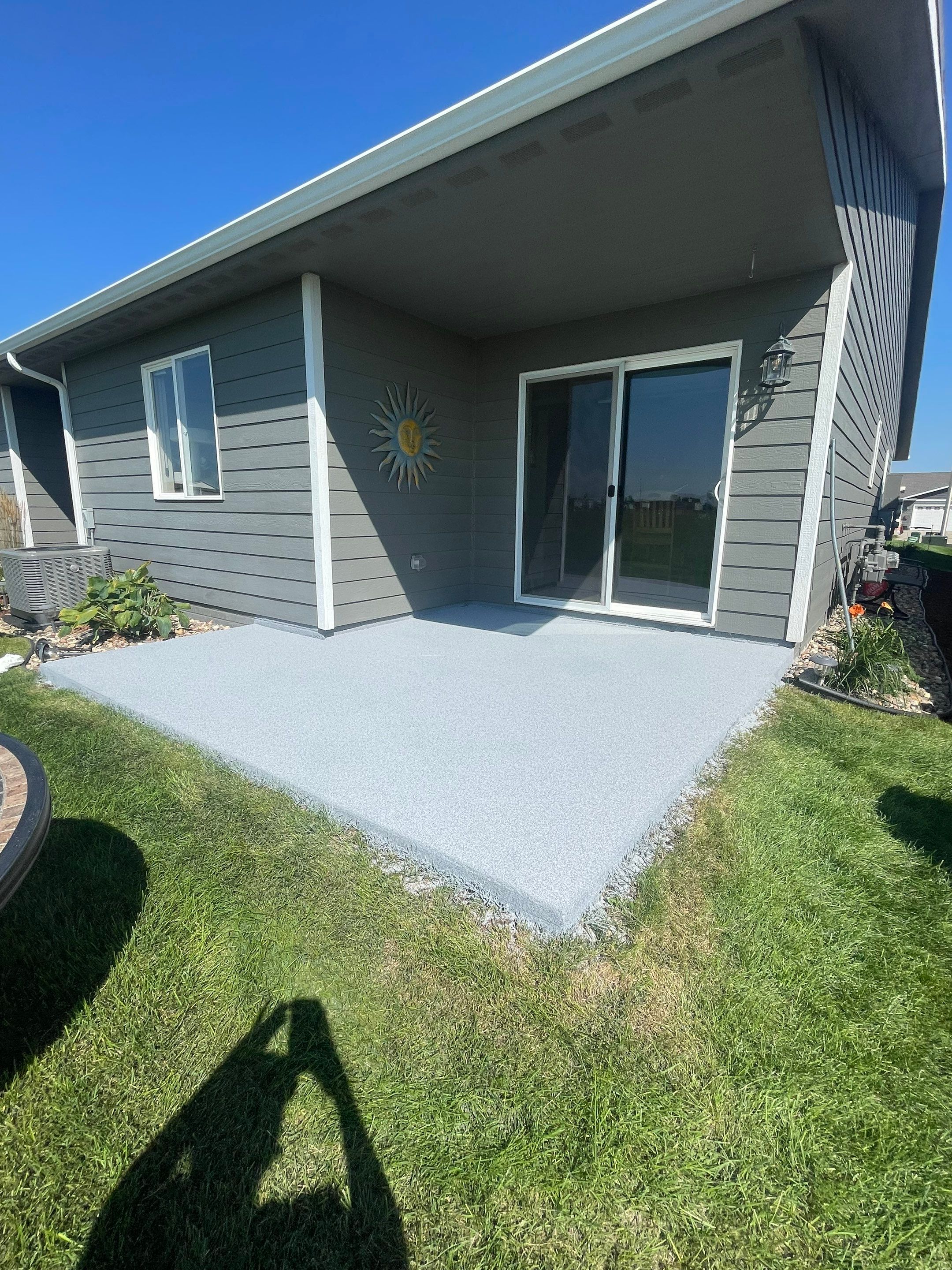 Starry Evening Concrete Patio Coating Installation in Tea by Select Painting, Coatings & Garage Cabinets