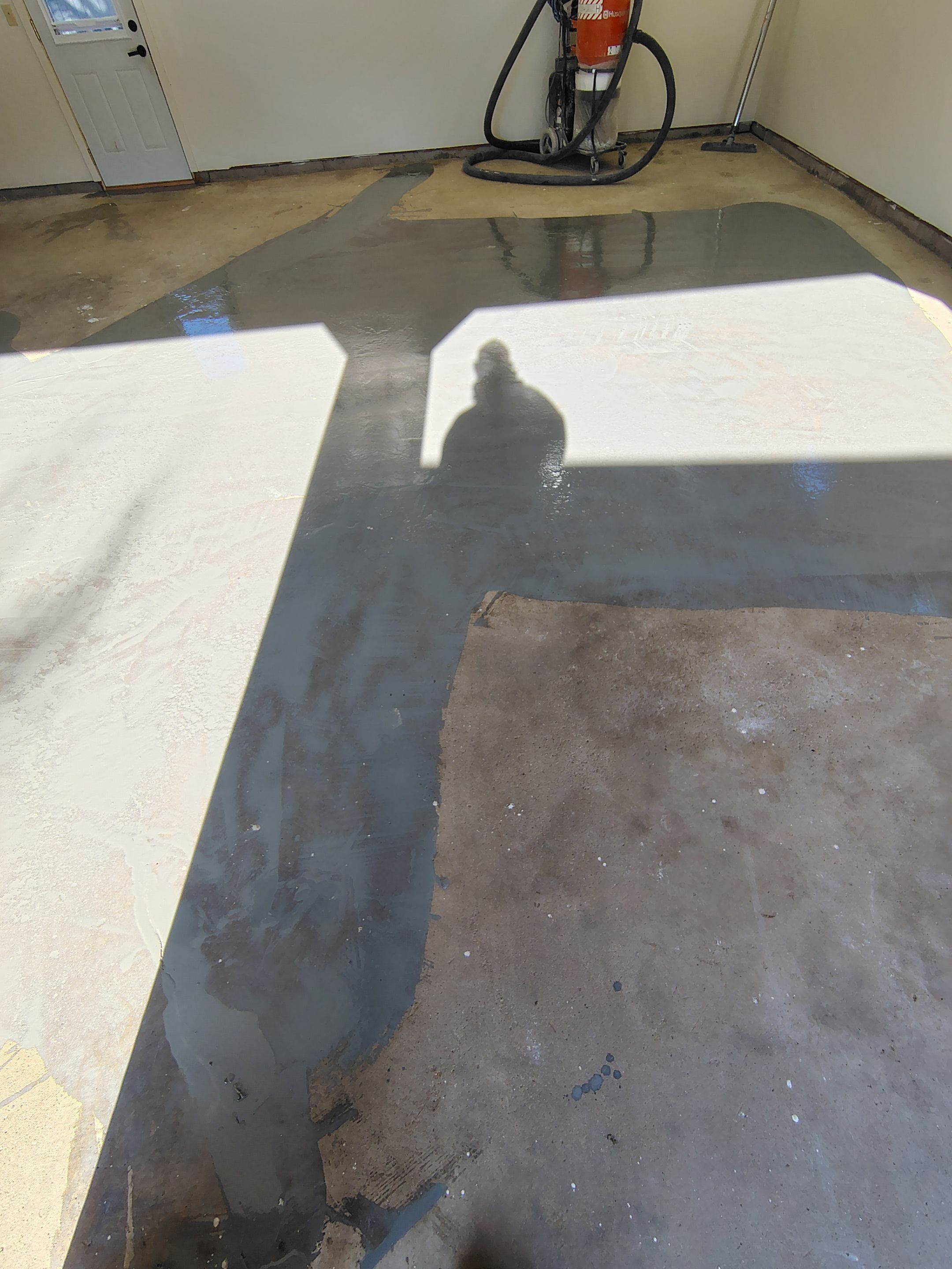 Full-Flake Epoxy Garage Floor Coating Installation in Sioux Falls by Select Painting, Coatings & Garage Cabinets