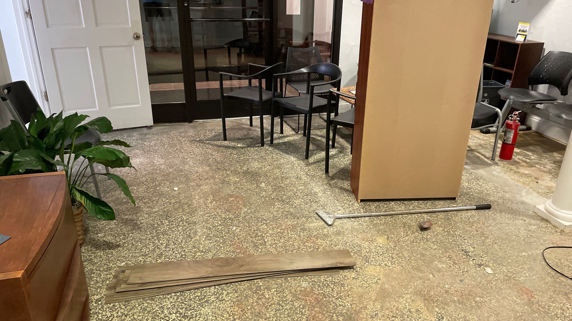 Office Remodel from Worn Out Carpet to Sleek Glued Down LVP by Footprints Floors of Coastal Carolina