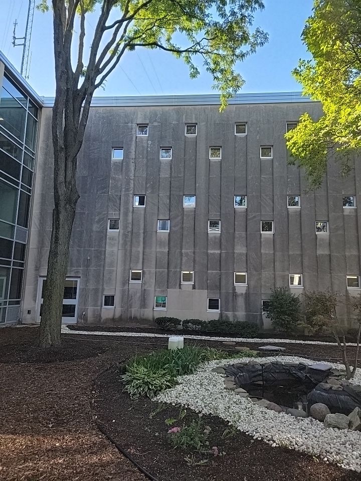 Courtyard pressure washing difficult access.  by Northern Power Washing LLC.
