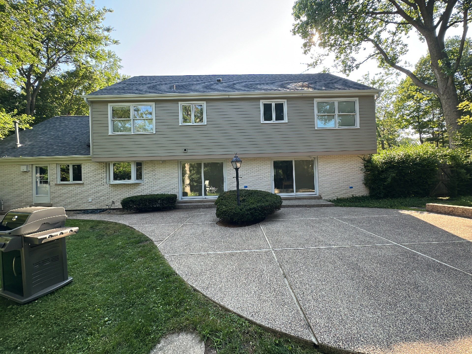 Aggregate concrete cleaning and sealing using Surebond SB-9000 by Northern Power Washing LLC.