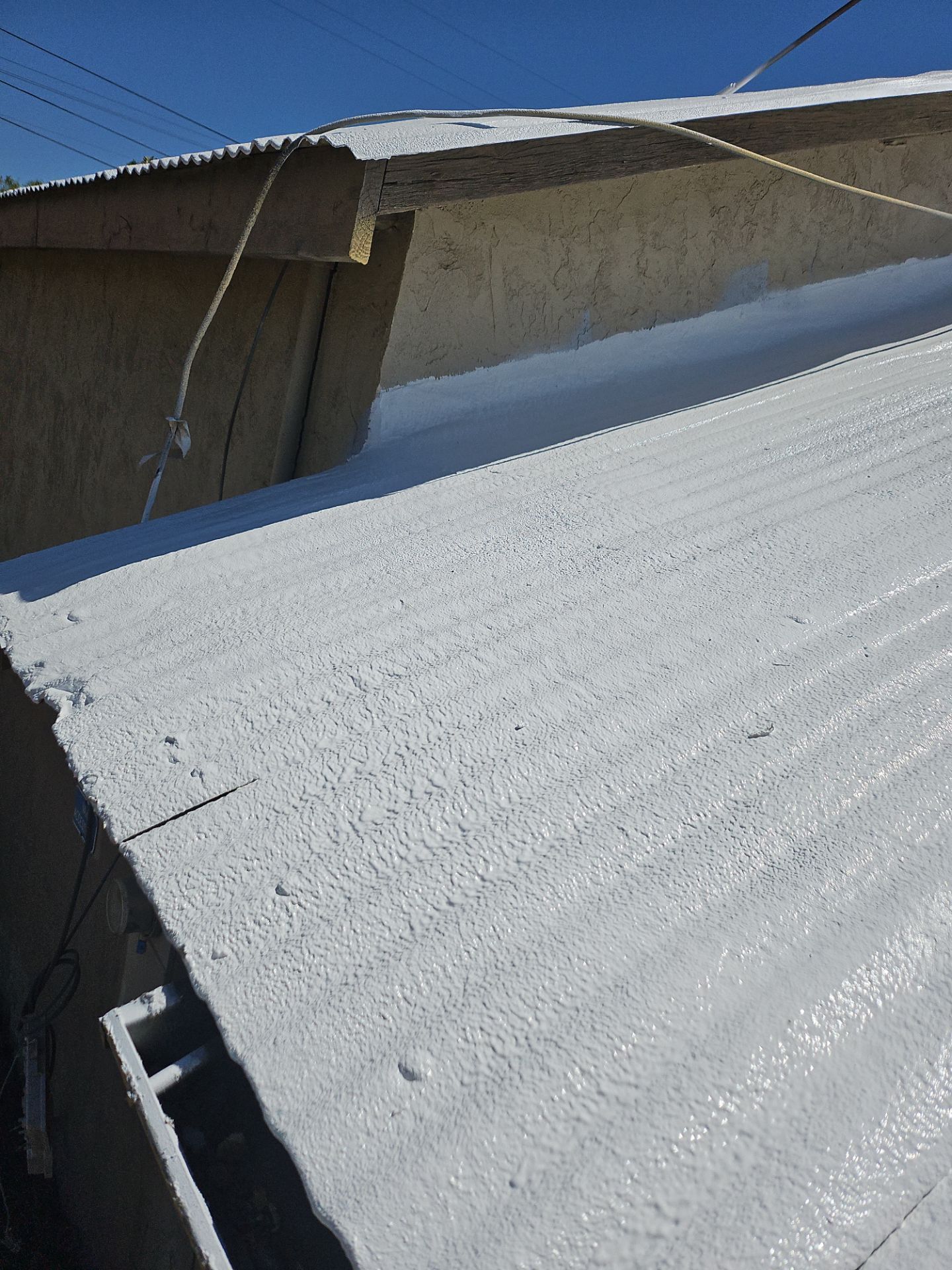 Spray foam and coatings using Conklin Benchmark/PUMA XL by Straight Edge Roofing Inc