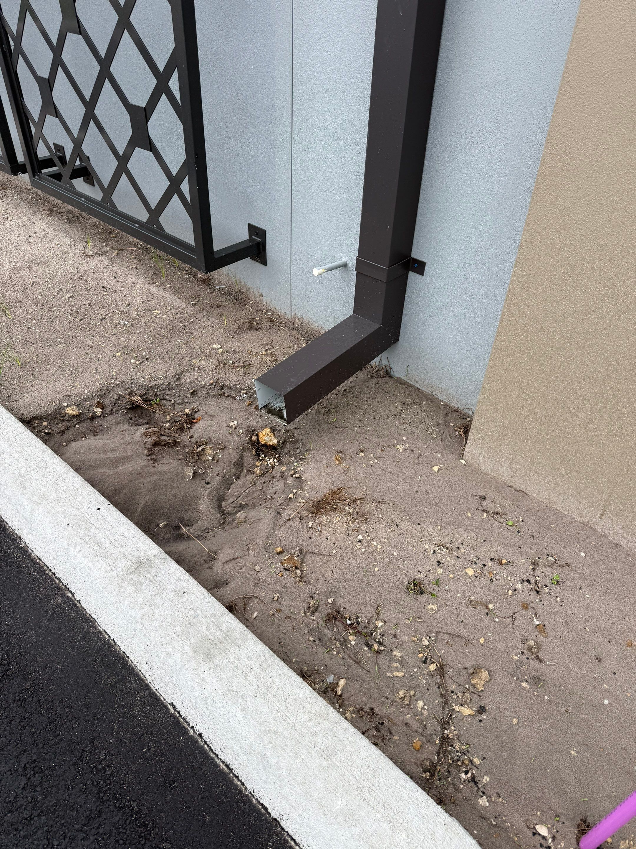 Downspout Installation using collector head in Cape Coral FL by Gutter Professors