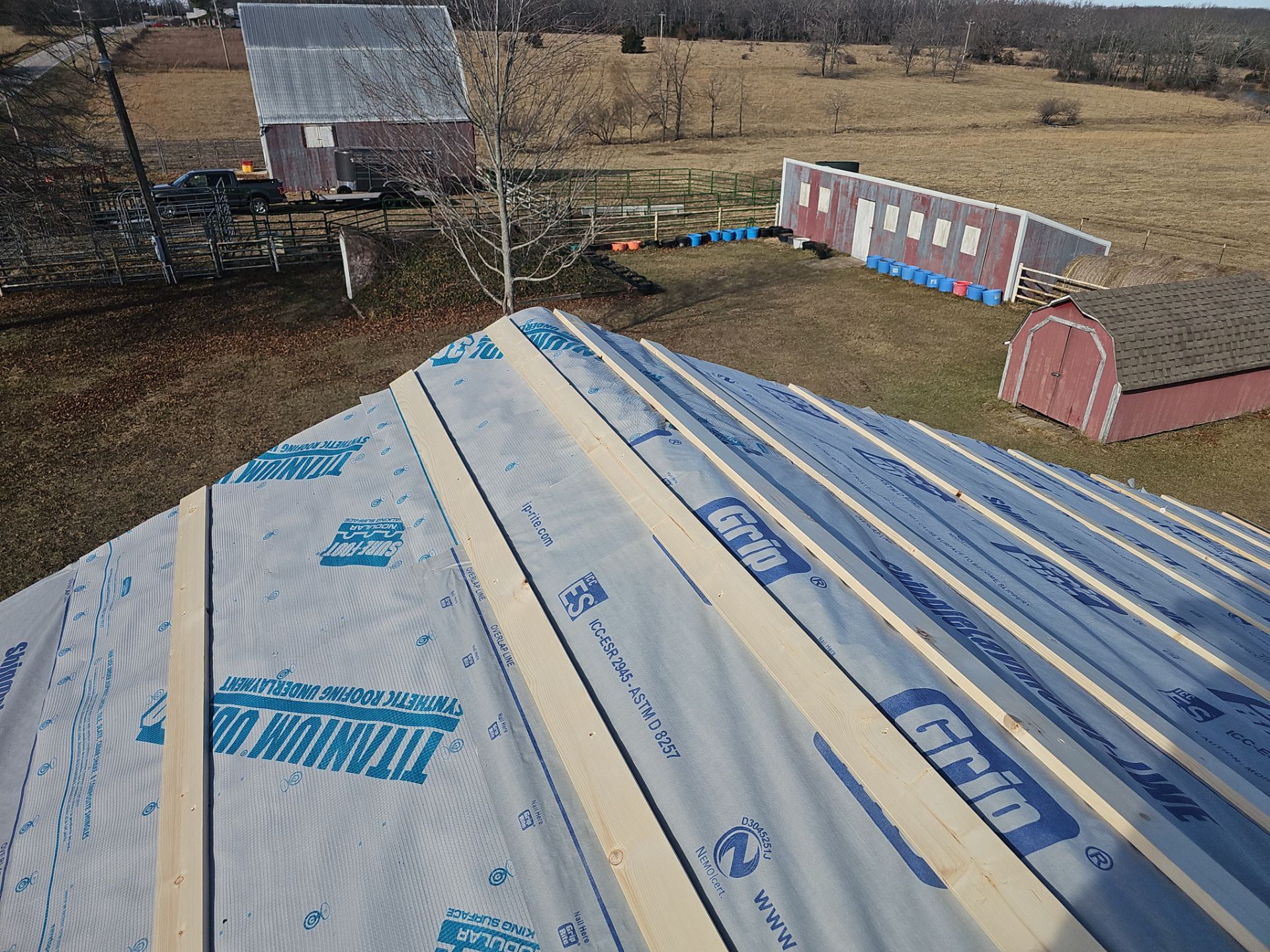 Residential 26 Gauge M-Rib Metal Roof + Gutters, Downspouts & Gutter Covers Install  by Titan Commercial & Residential Roofing 