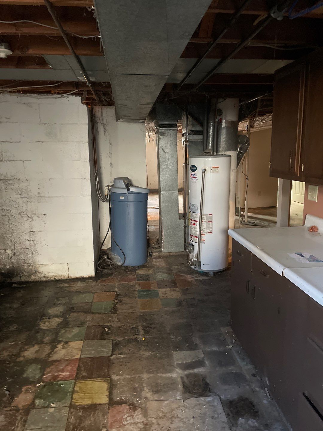 Interior drain tile system installation by ACE Waterproofing & Basement Solutions