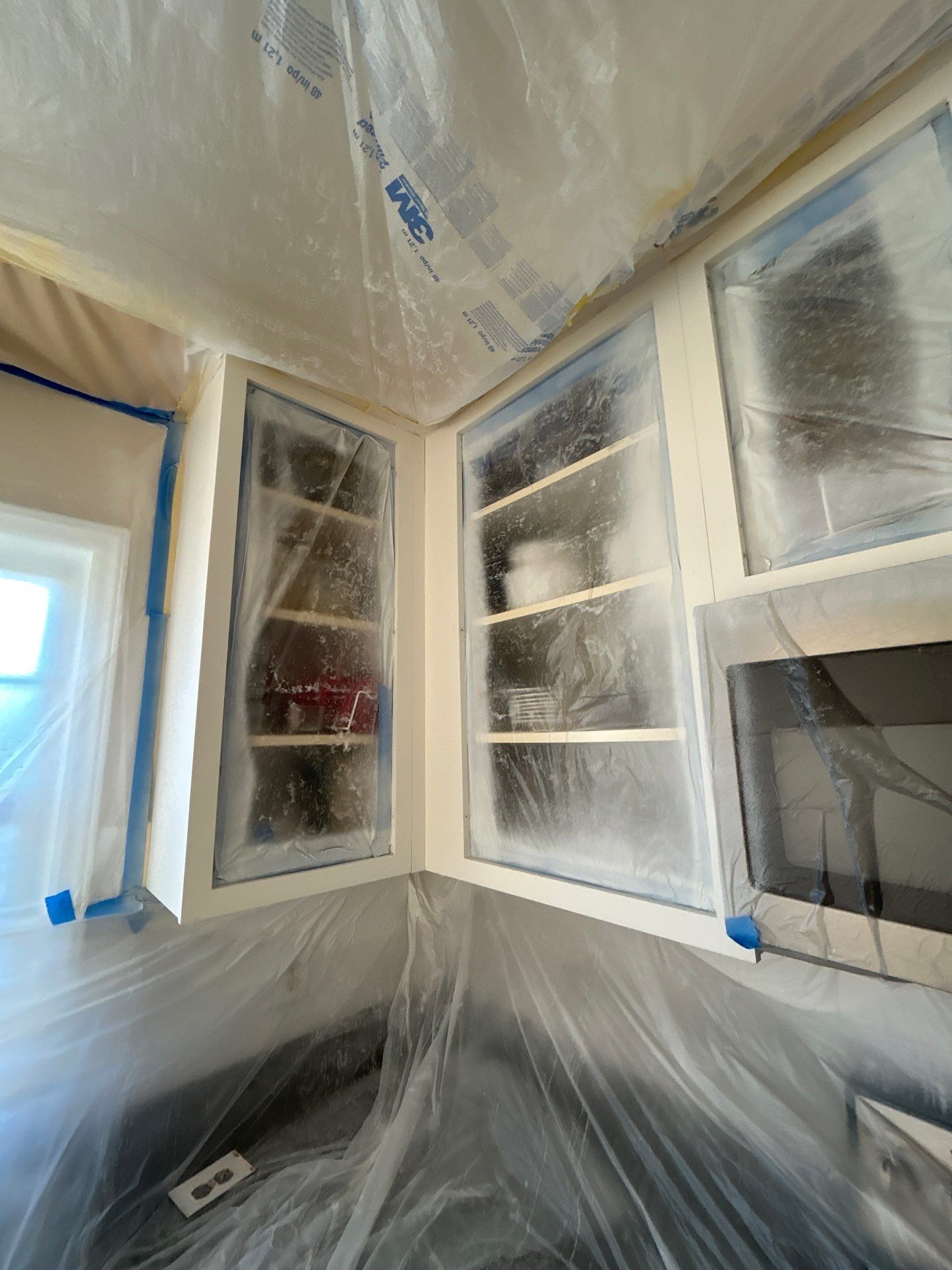 Cabinet painting by GonzalezPainters & Contractors Inc 