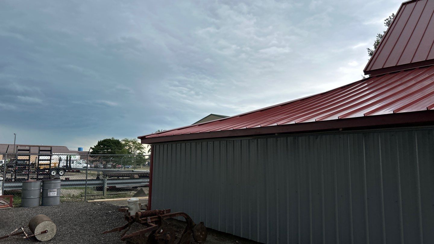 Residential Roofing Installation using Standing Seam Metal - Barn Red by RoofX 