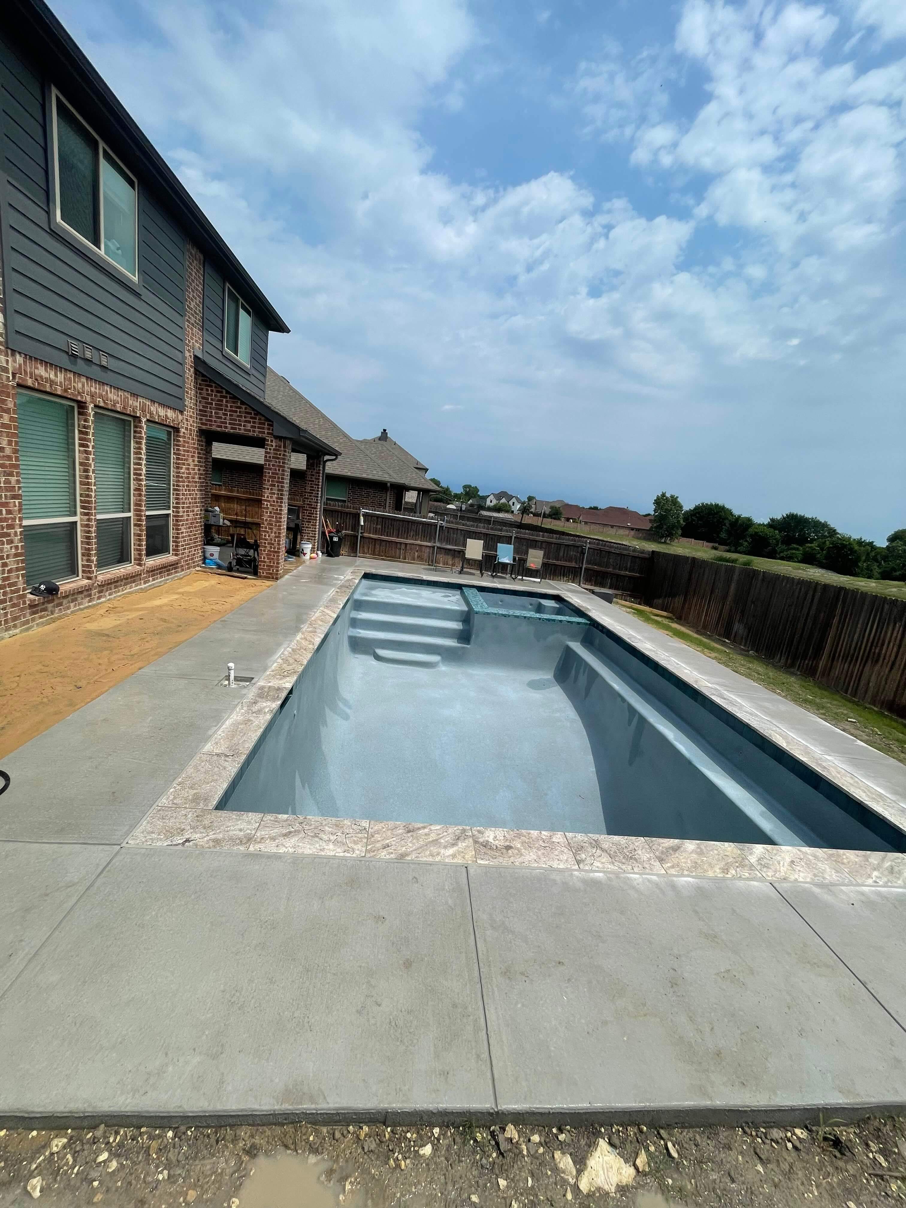 Geometric Pool with Tanning Ledge by Pinnacle Pools and Spas - DFW