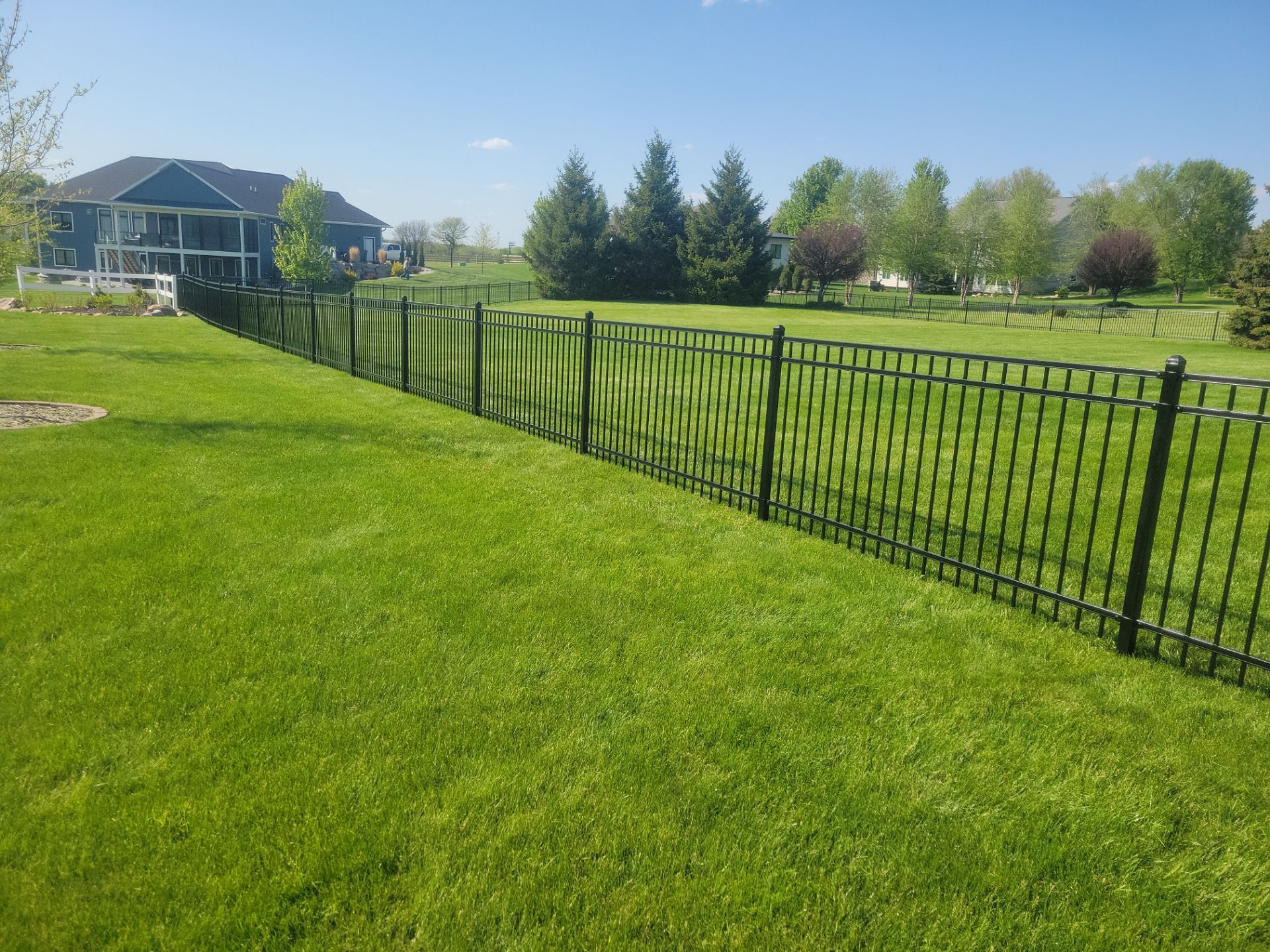 Black Ornamental Metal Picket Fence Installation in Waterloo by Perfect Picket Fence and Stain