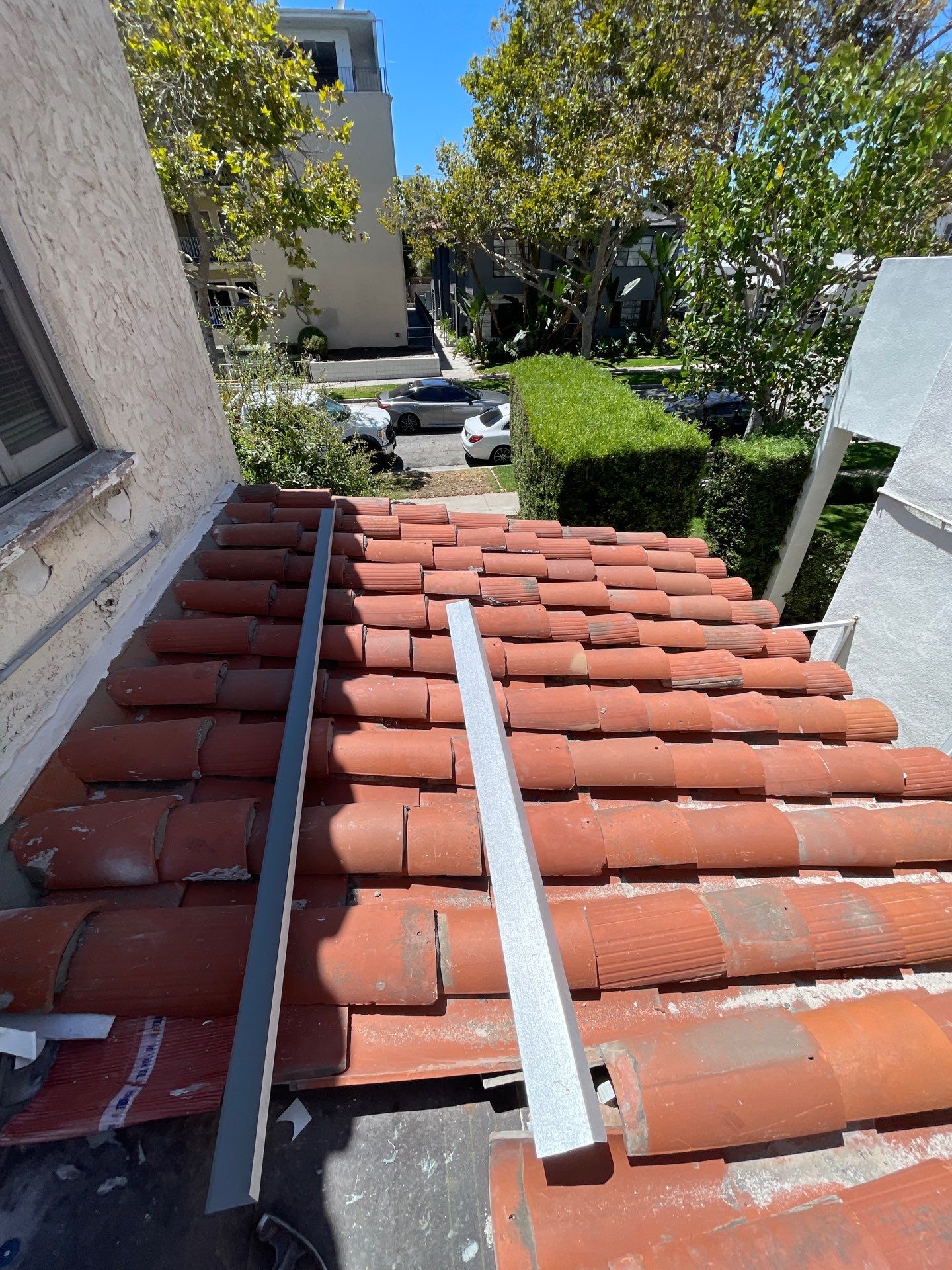 Beverly Hills Flat Roof Coating and Terracotta Tile Reset by Hull Brothers Roofing