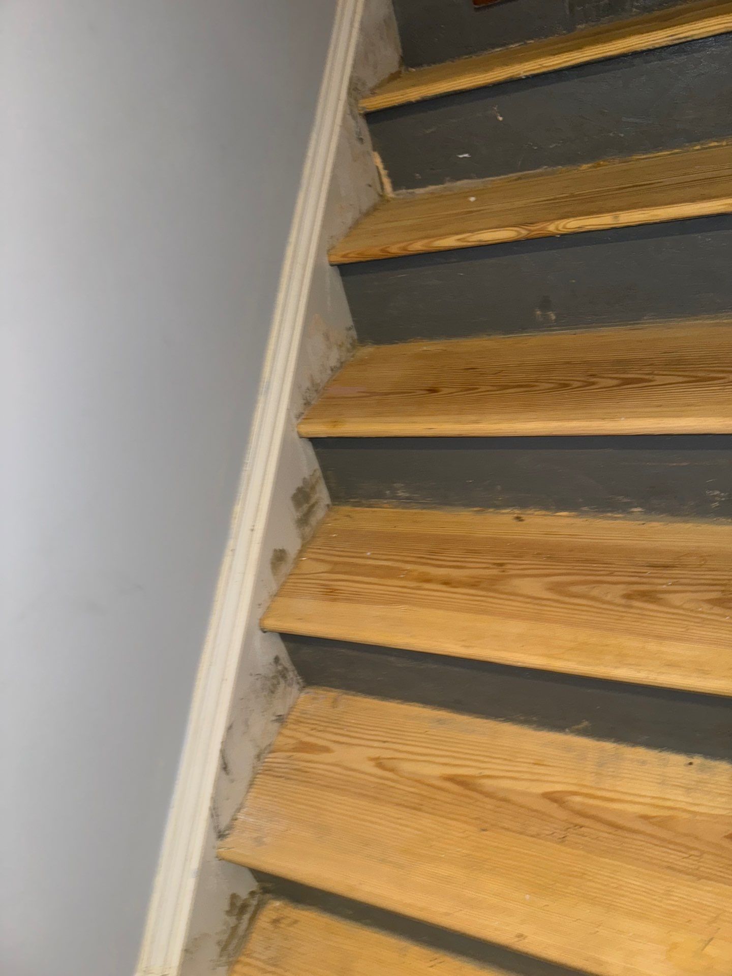 Stairway Installation using t vinyl stair tread and reversibleriser by La Bendicion Contruction Llc