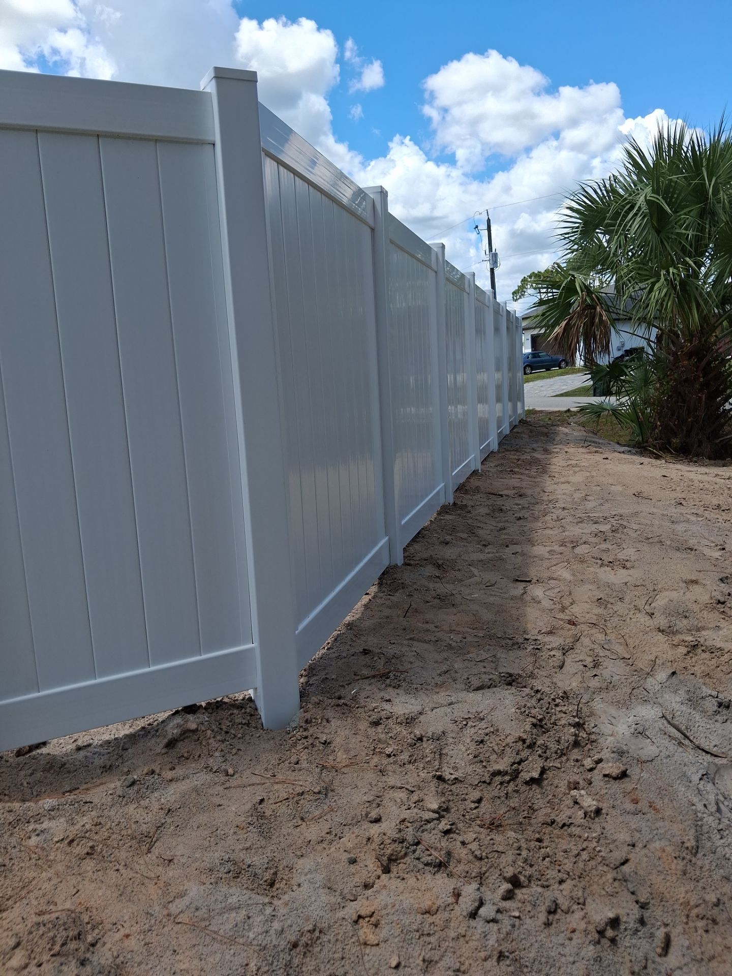 White Vinyl Privacy Fence Installation in North Port Florida by True Fence LLC