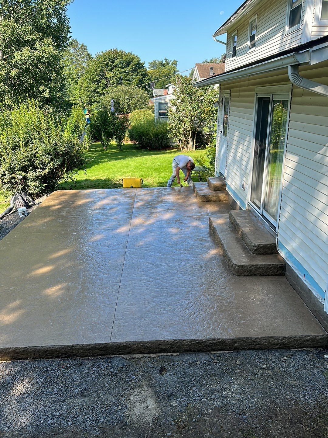 Bluestone textured stamped concrete patio by NG Masonry & Construction LLC
