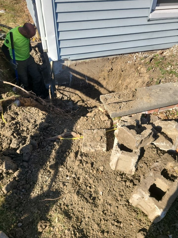 Lifting Home With Piers using Magnum Piers by Toledo Basement Repair